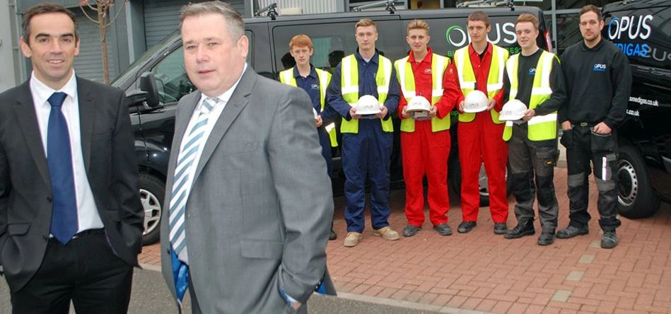 WELCOME ... Gavin Richardson, left, and Bryan Wood-Laine, right, with their five new apprentices and