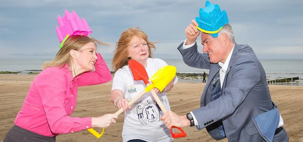 Carol Taylor (centre) from Children North East gets between Kate Brooks and Stephen McCoy as the riv