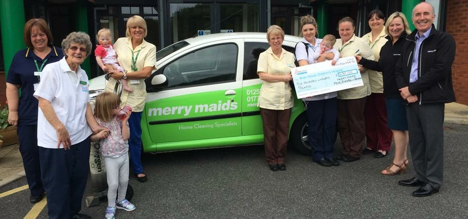 Nicky and Steve Morris, Merry Maids Blackpool, Fylde and Preston (far right) with staff and children
