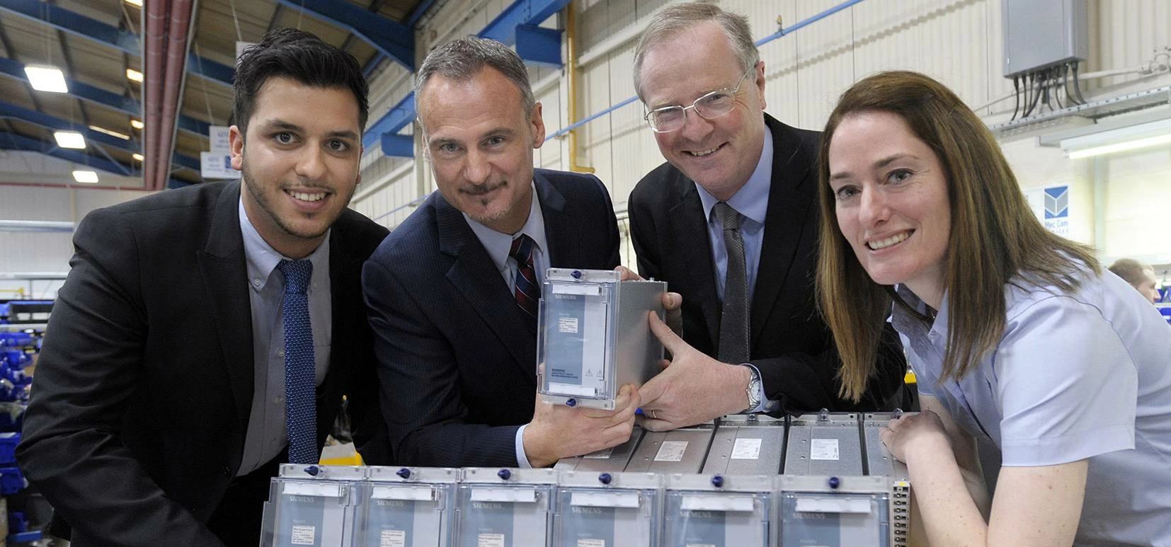 Record Deal: (l-r) Richie Davda, Richard Bunce (both Mec Com), Jeremy Lefroy (MP for Stafford) and D