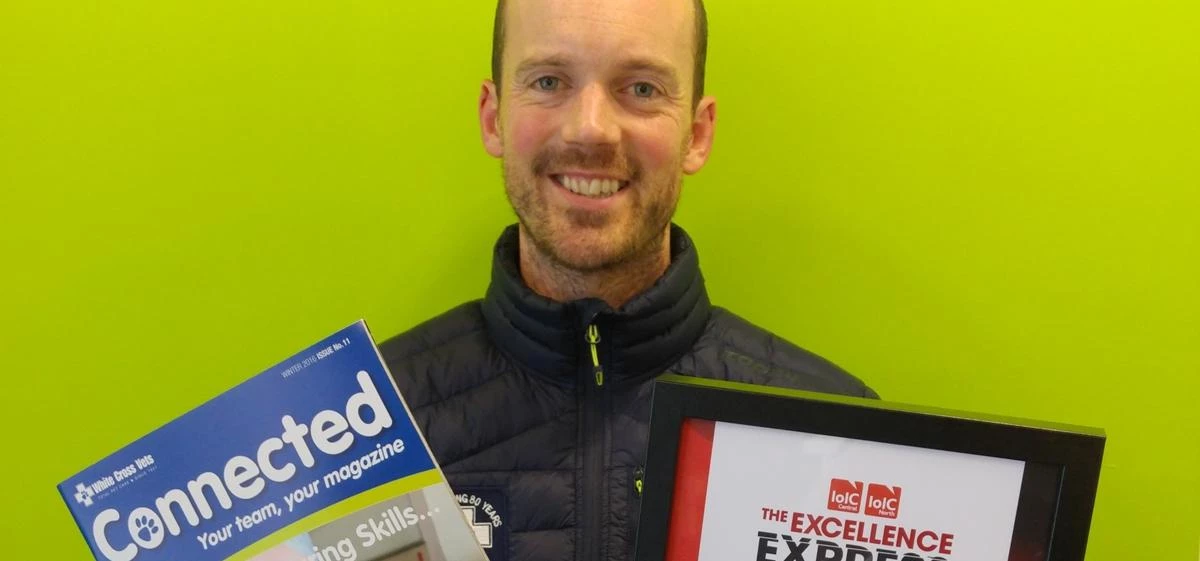 Justin Phillips, Head of Marketing at White Cross Vets, with Connected Magazine and the IOIC Award.