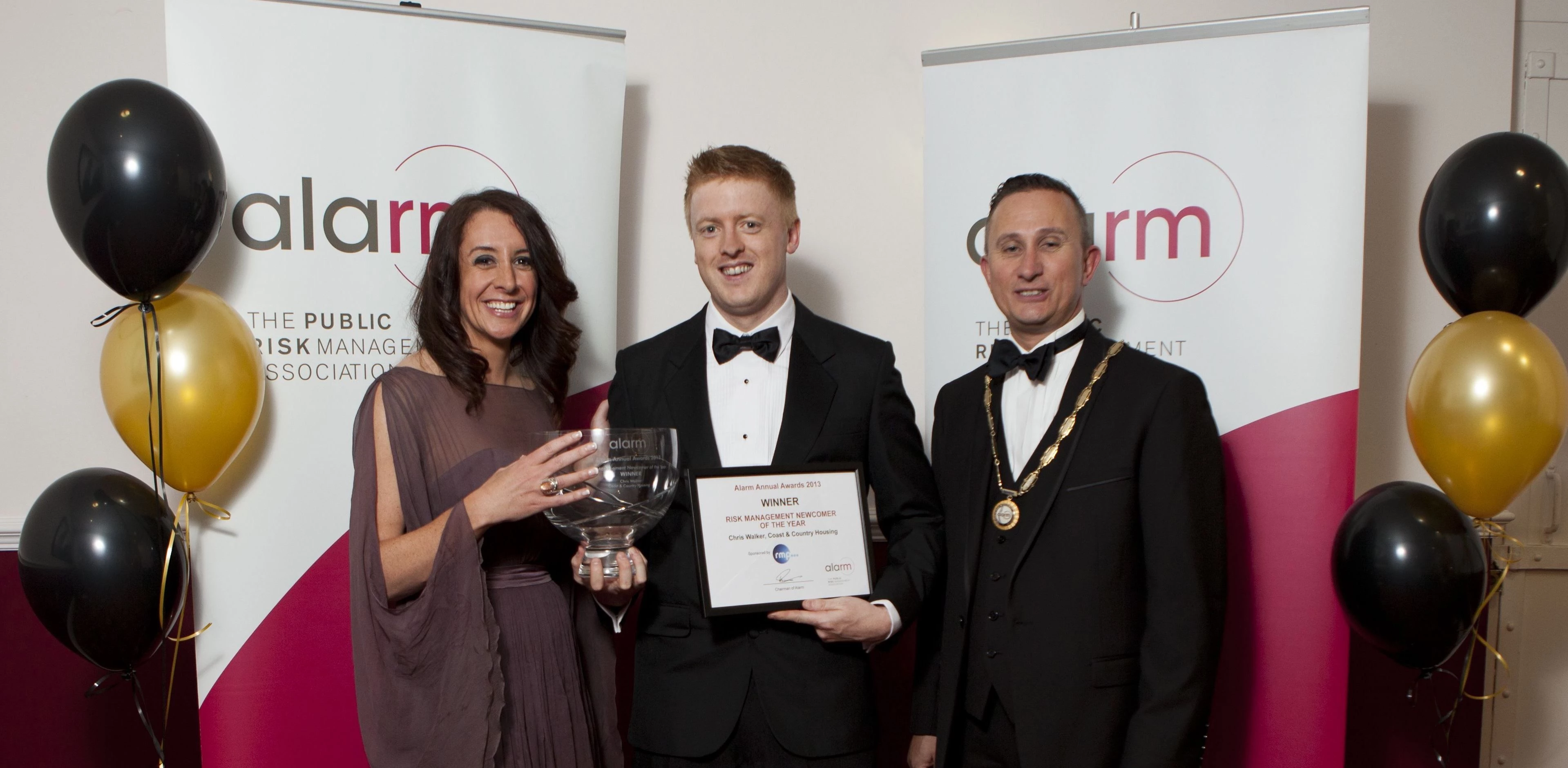 Chris Walker, centre, with Lucy Seigle, of The One Show, and Wayne Rigby, Alarm chairman