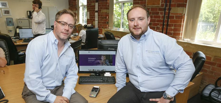 Sales & Marketing Manager, Richard Farnhill and Founding Director, James Howard with the AIB website