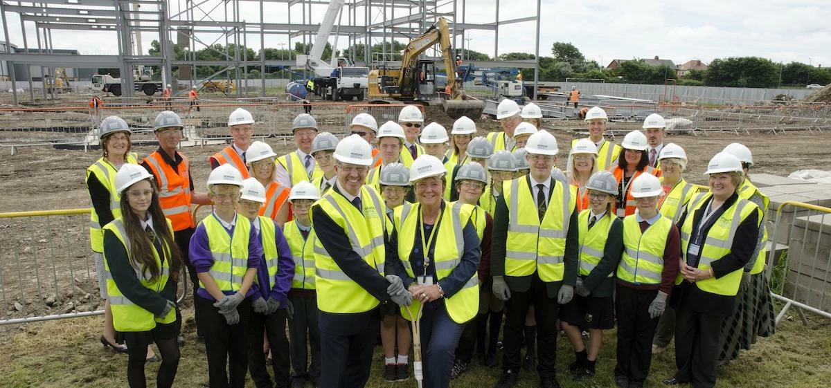 PSBP NW Project Co Ltd’s Gary Naylor and South Shore Academy principal Jane Bailey hold the spade at