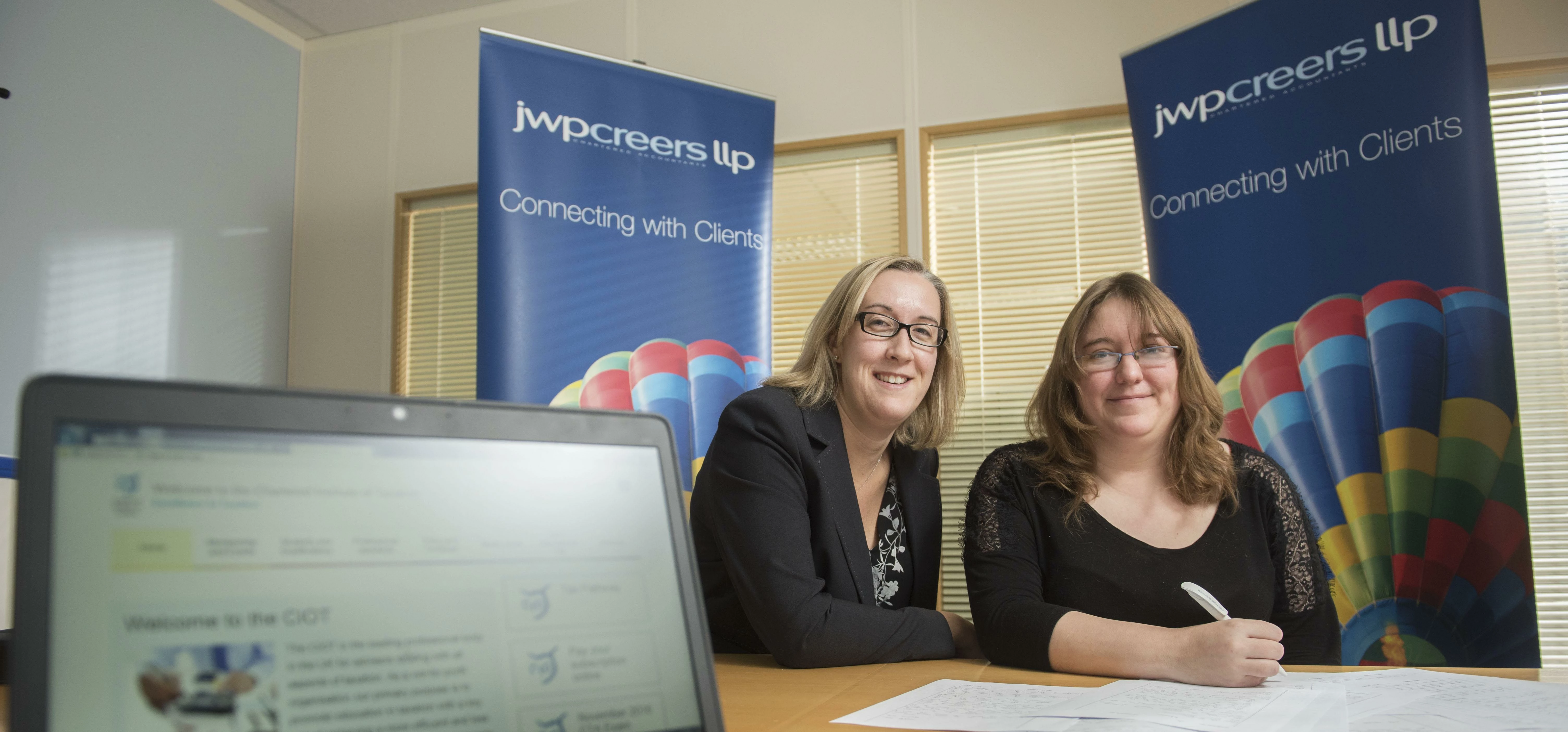 THE ANSWERS HAVE IT:  JWP Creers assistant tax manager, Laura Train, (right) with training partner, 