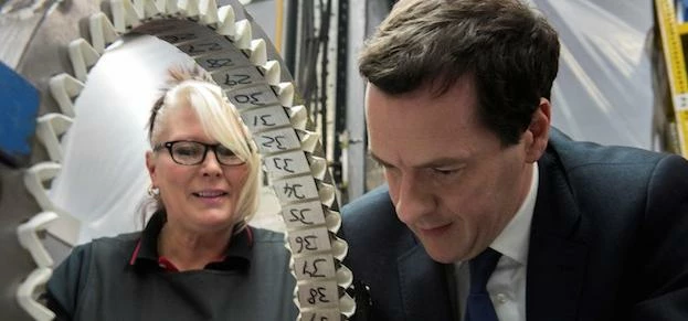 Supervisor Jane Paley looks on as Conservative Chancellor George Osborne during a visit to Winder Po