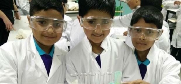 Primary school visitors enjoying a chemistry experiment during their taster day. 