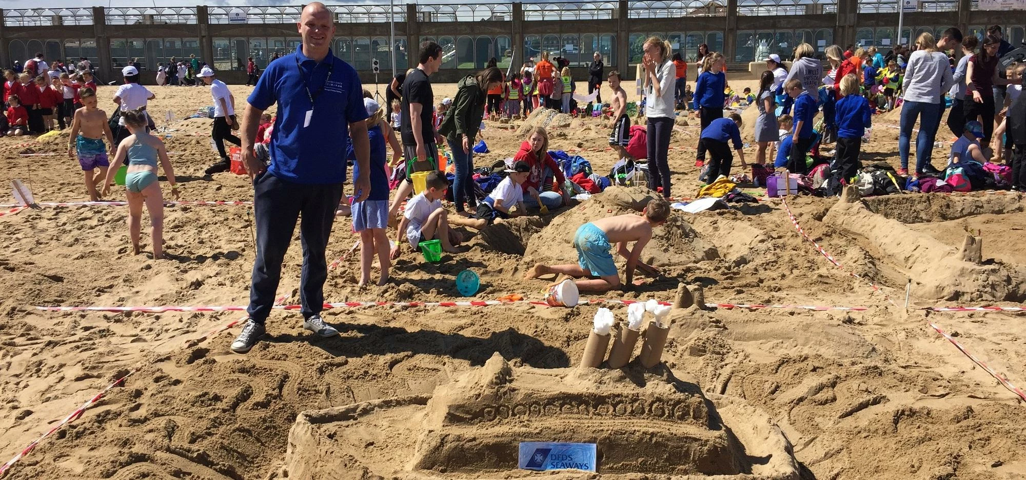 Steve Walker of Godfrey Syrett at Sand Haven beach for the annual Sandcastle Challenge