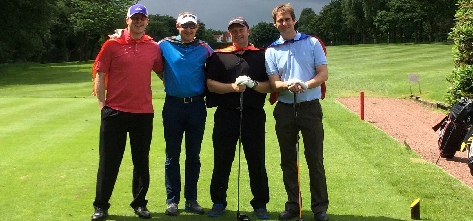 Nick Baxter (far right) with his team of golfing superheroes