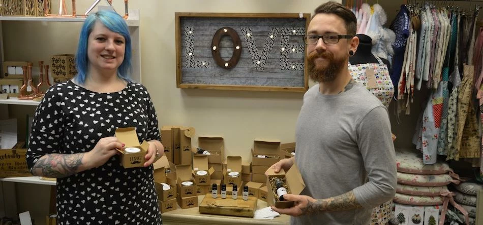 Laura and Thom displaying their products