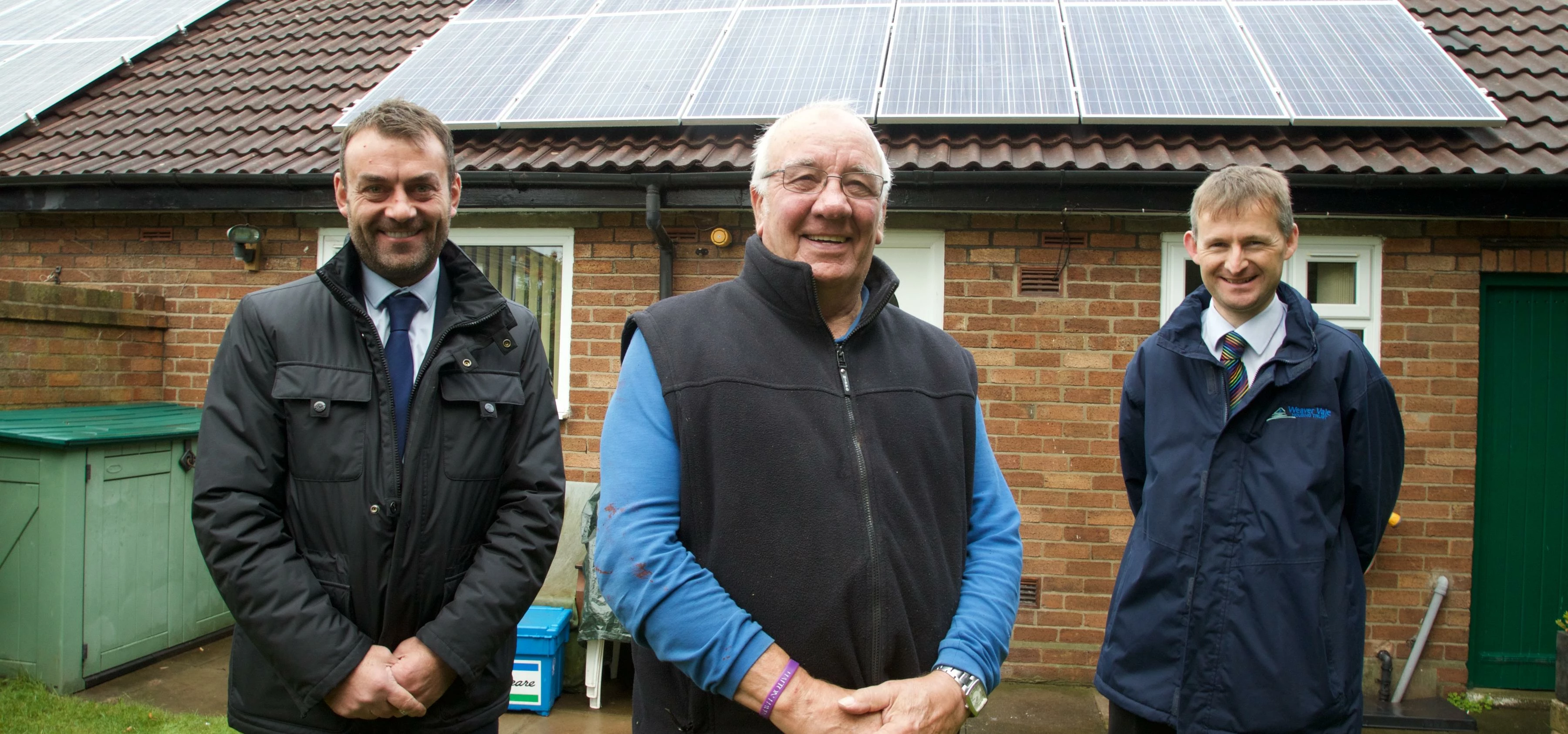Weaver Vale Housing Trust customer Mr Mercer (centre) will save money on his energy bills, following