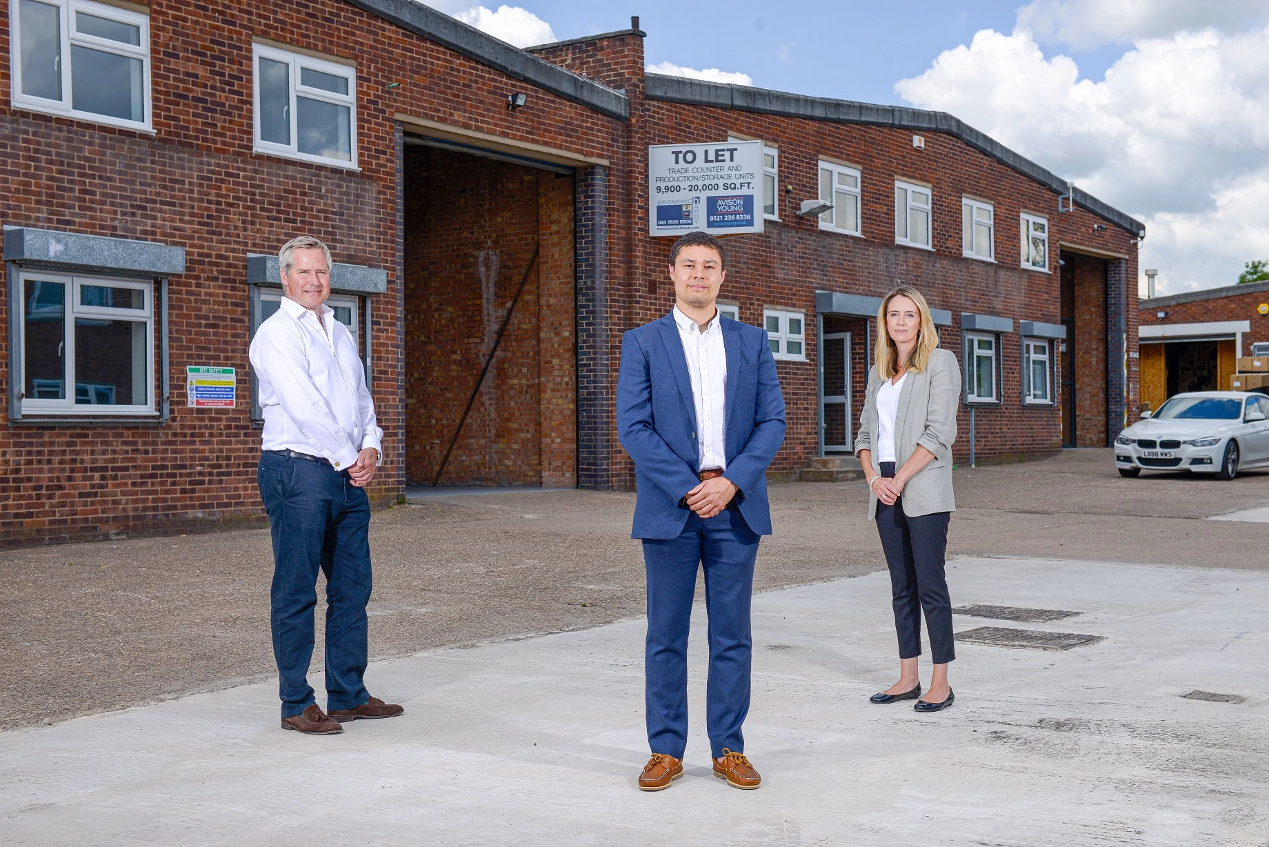 Louis Smith (The Wigley Group) is pictured front with Tom Bromwich (Bromwich Hardy) and Tesni Thacker (Avison Young) outside the refurbished units at Albion Industrial Estate.
