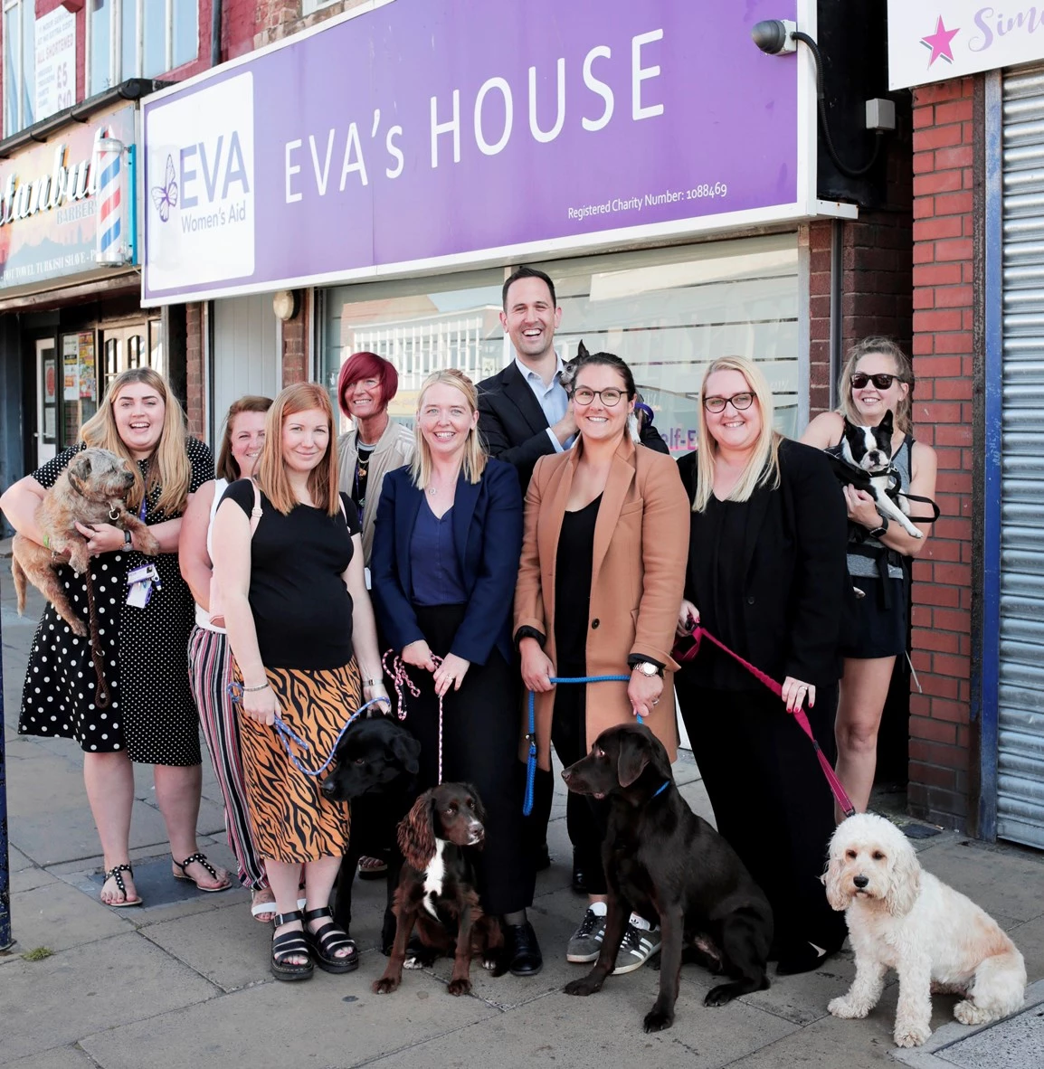 The teams from Cygnet Law and EVA Women's Aid with dogs