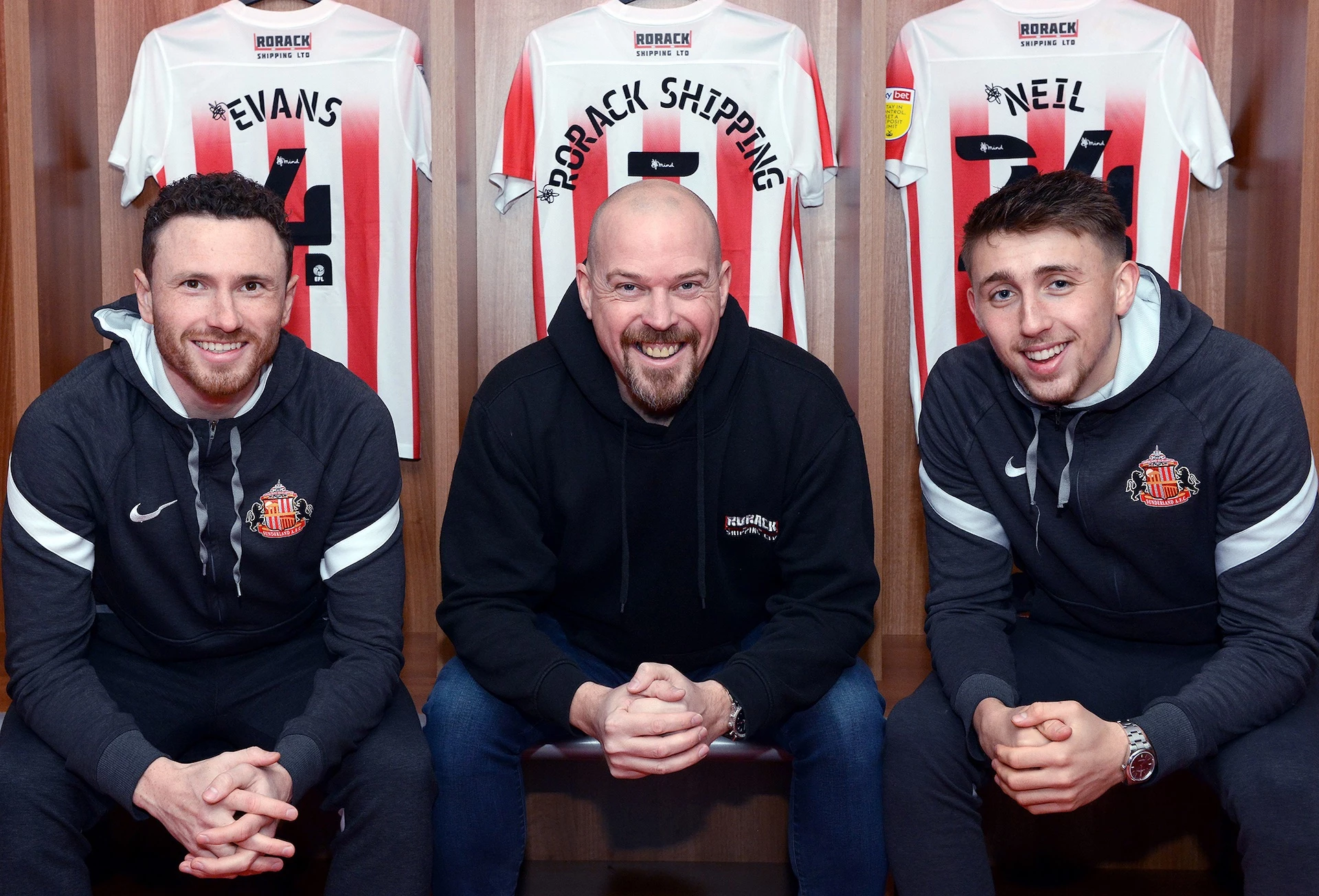 Tim Finley (centre), Managing Director of RoRack Shipping with Sunderland AFC’s Corry Evans (left) and Dan Neil (right)