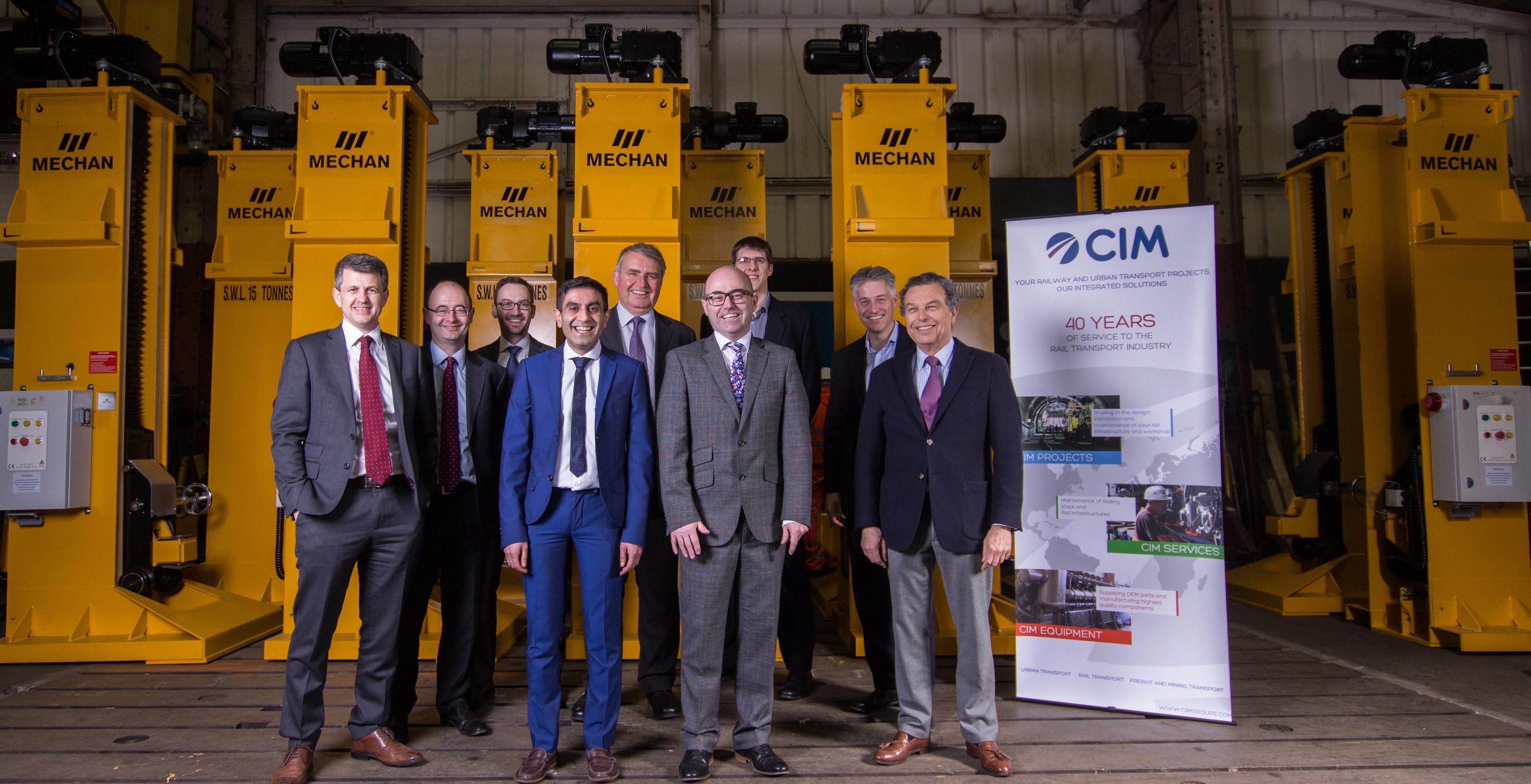Mechan sale boosts growth: advisors including Paul Trudgill, hlw Keeble Hawson, back row, far right with Zahir Altaf, Mechan FD (front row 2nd left) , Richard Carr, Mechan MD (front row 3rd left) and Alain Lovambac, CIM Group CEO (front row 4th left)