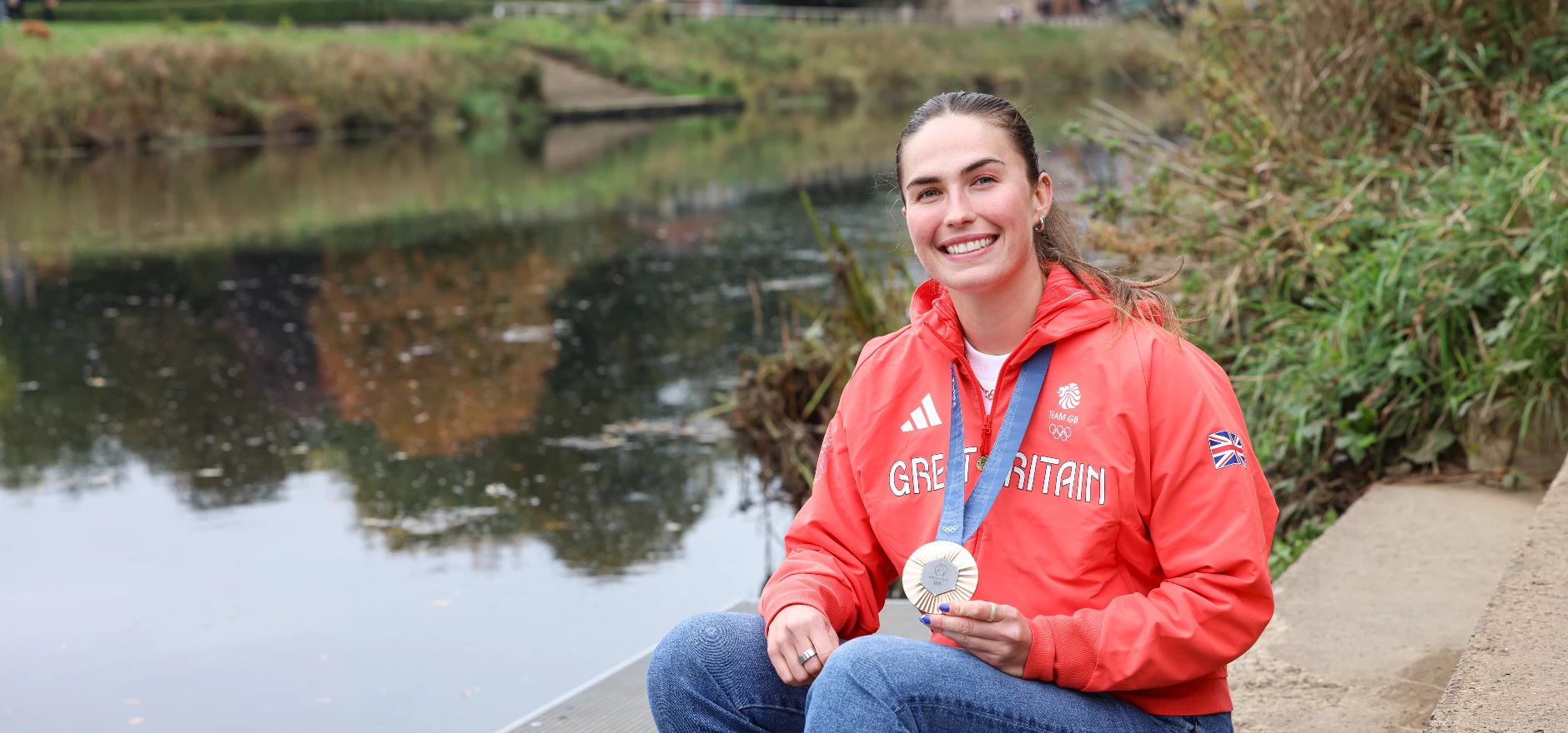Image 3 - Lauren Irwin at Elvet Waterside sat near the new HBBC landing stage with her Olympic medal.jpg