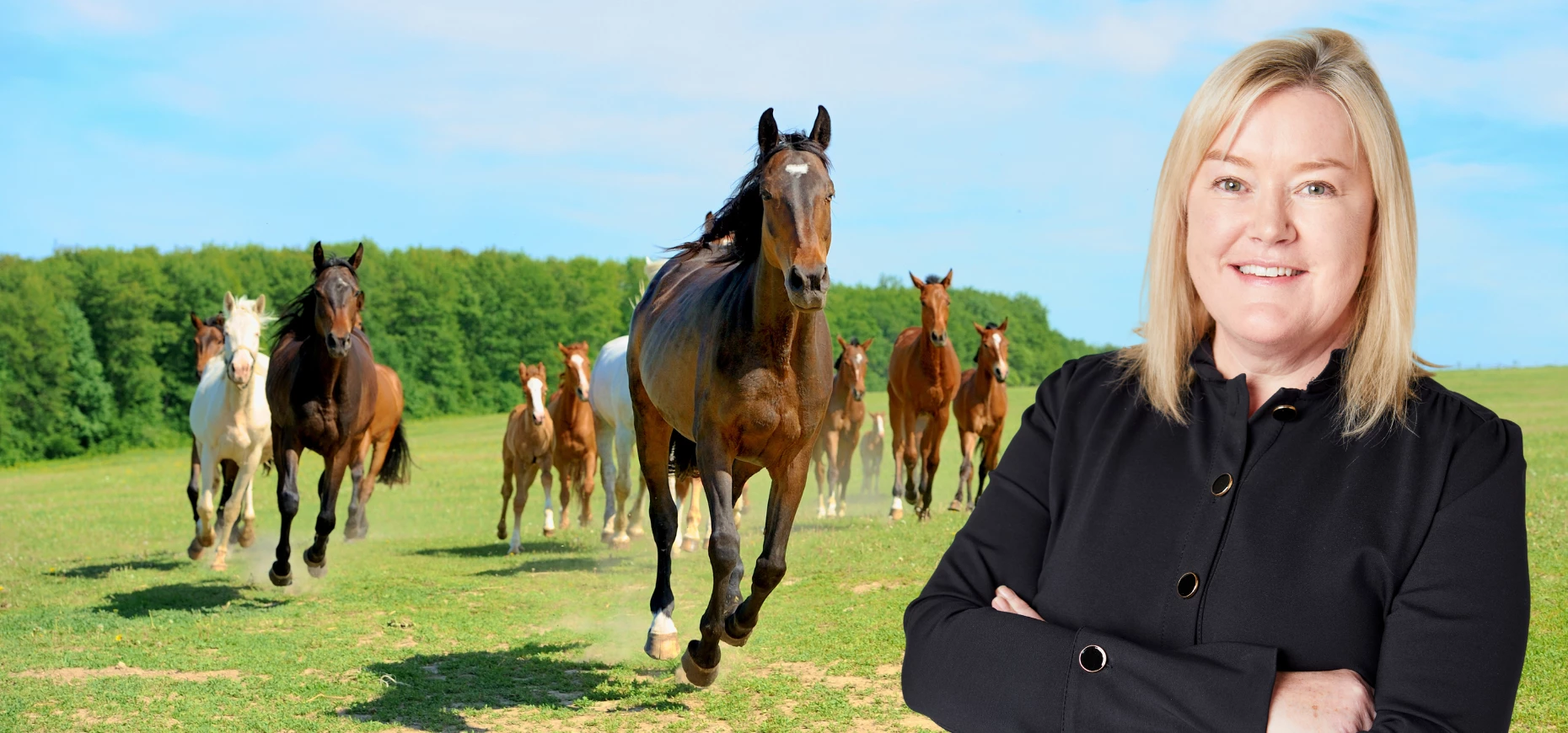 Liz Hopper, Managing Director at Harry Hall, pictured against a group of running horses.