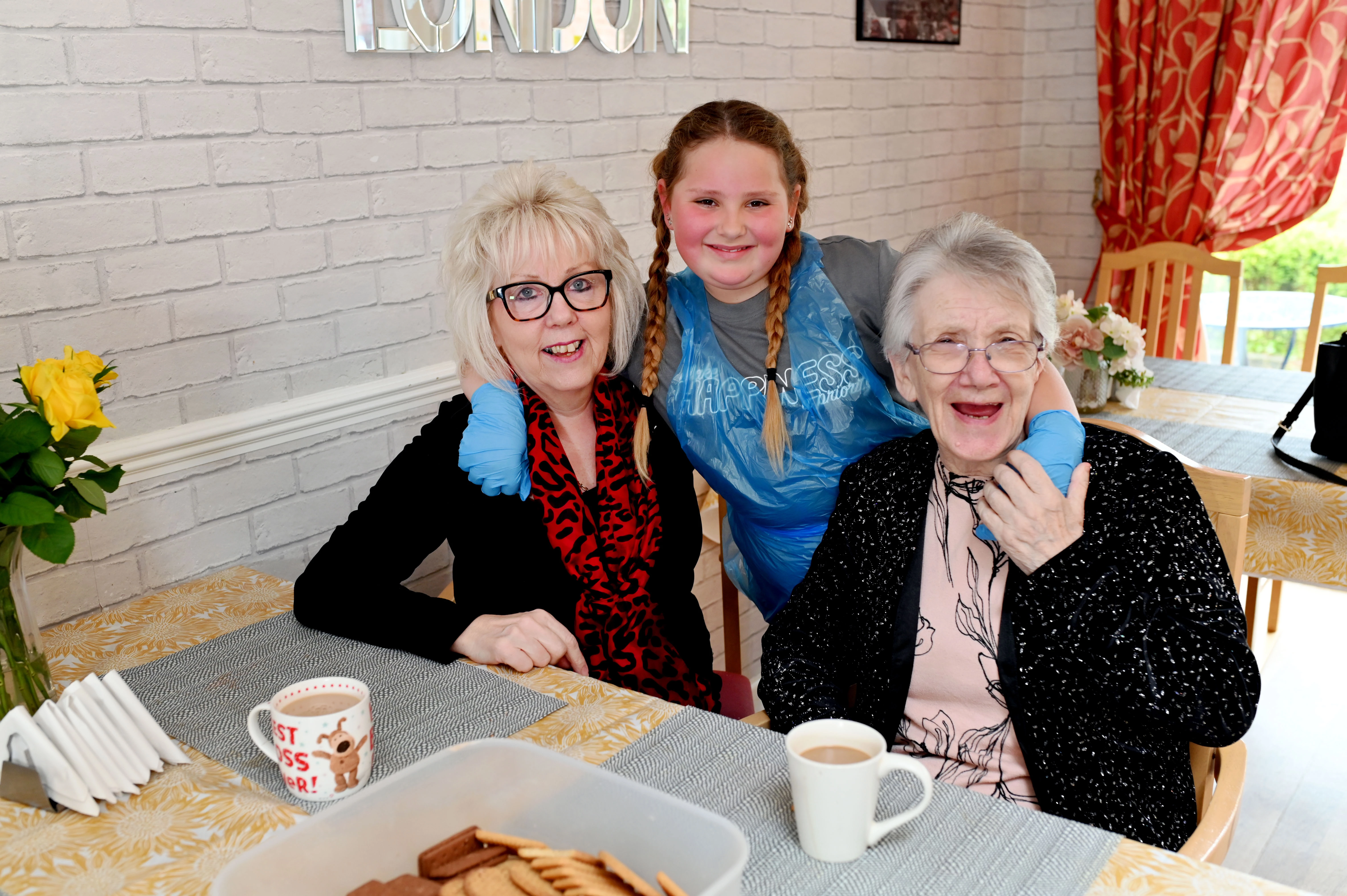 Maisie with home manager Mandy Chapman and resident Sheila Young