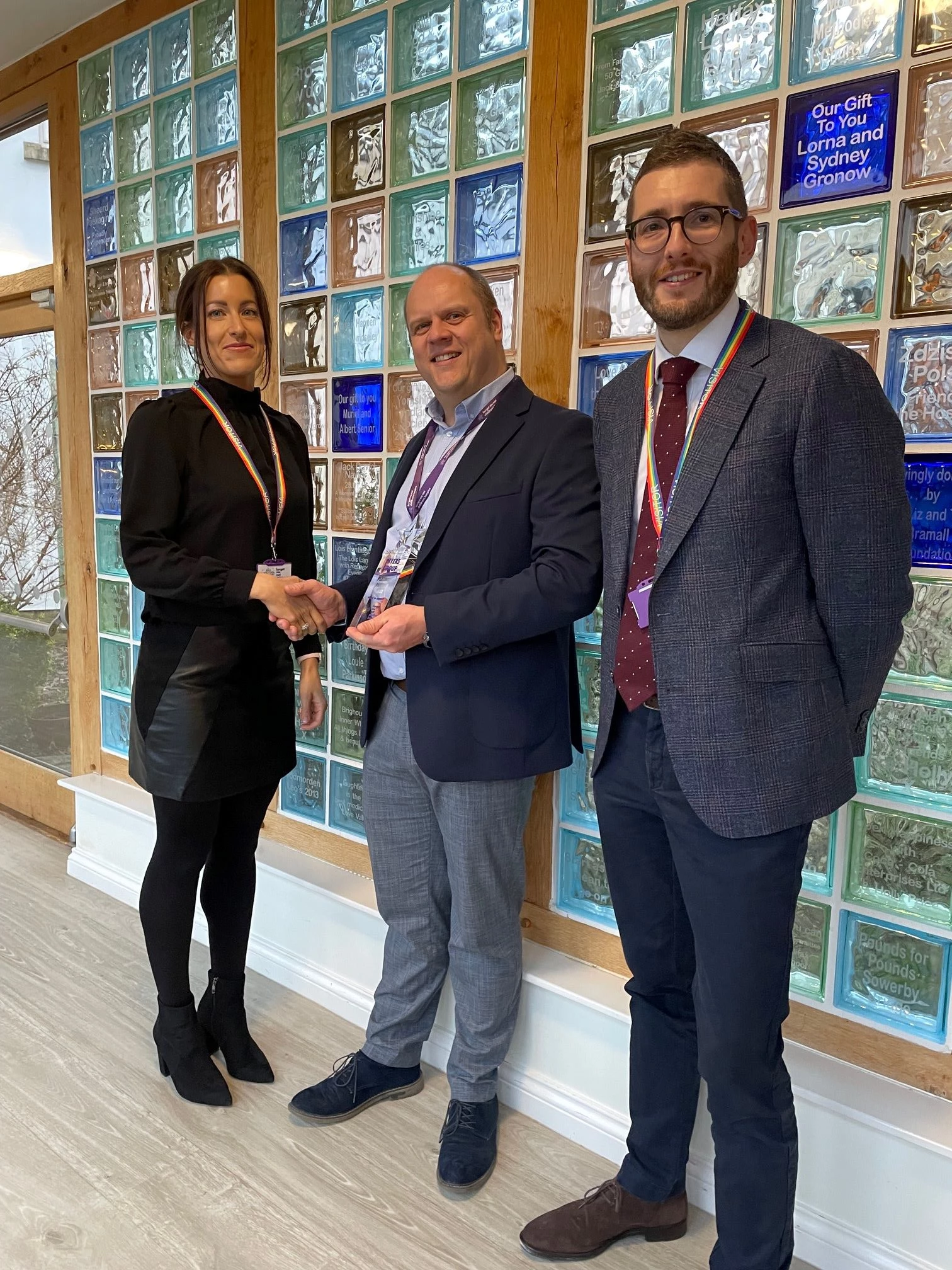 Gareth Pierce, Forget Me Not Children's Hospice, CEO, centre, presents a Platinum Partner Plaque to James Berry, Managing Director and Katie Berry, DIrector, The Myers Group 
