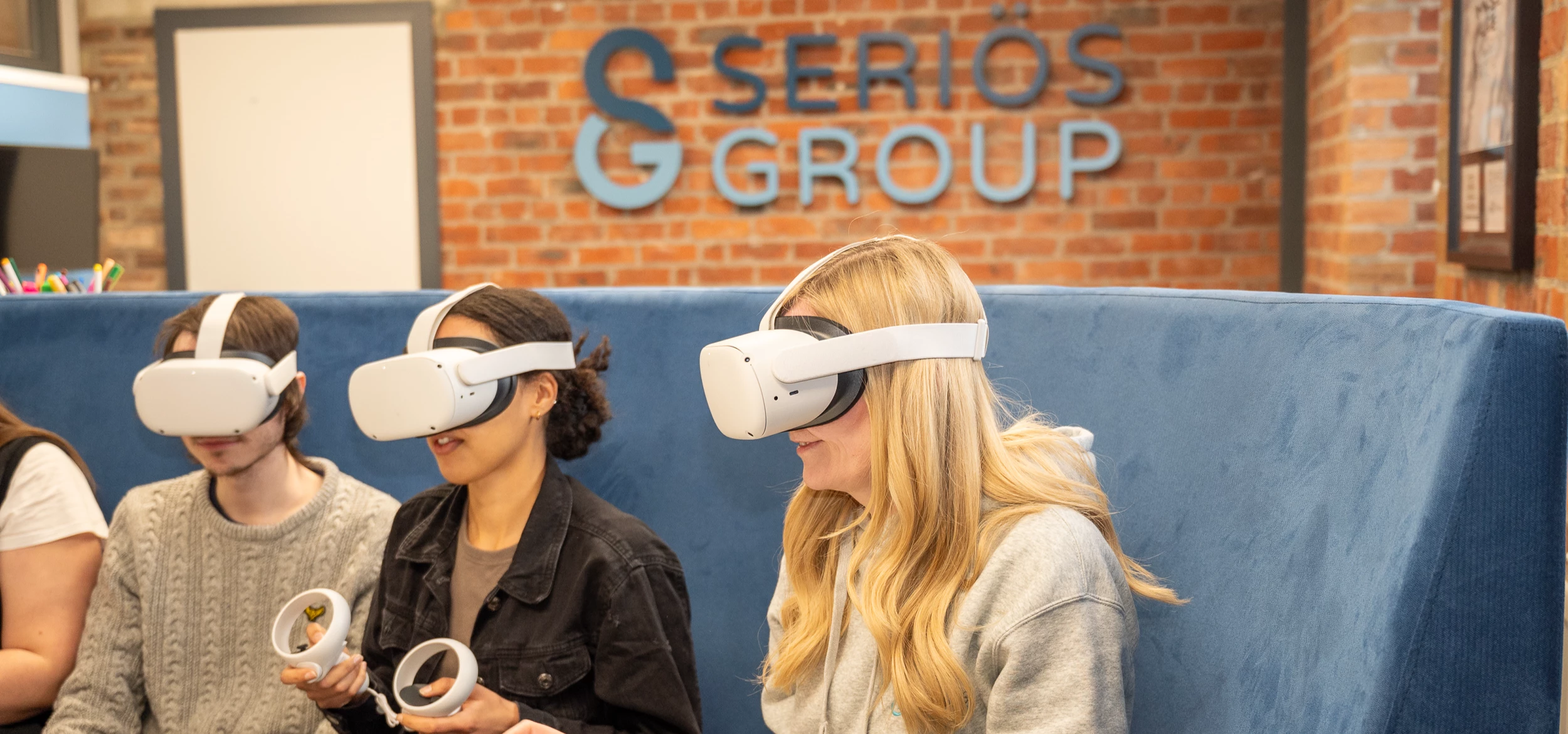 Members of the Seriös Group team using Meta-Quest headsets to hold a meeting in the Metaverse