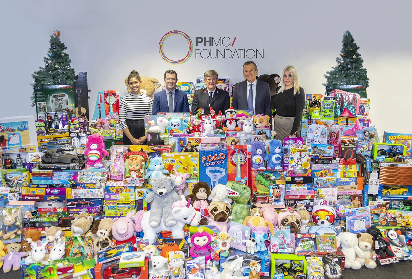 PHMG team presents Salvation Army with toys from Global Toy Drive