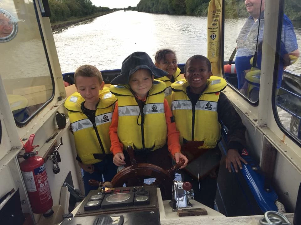 Youngsters at the wheel - The Ethel Trust Community Barge
