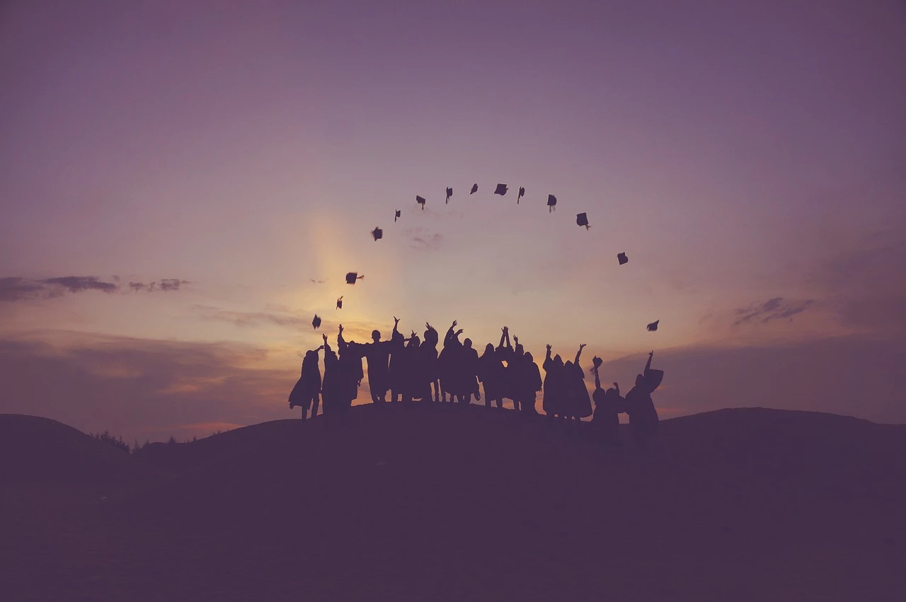 Graduates throwing hats in the air