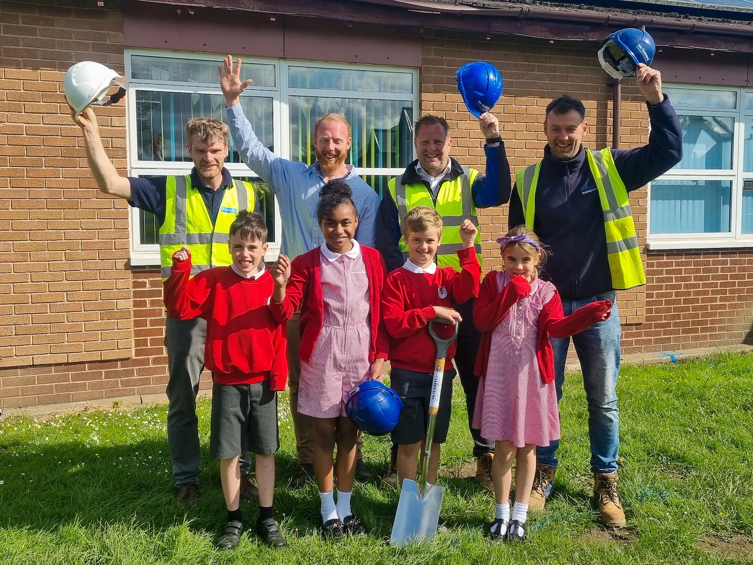 (L-R) Senior architectural technologist at Property Services Group Martin Ellis, head teacher Carl Rogers, Pave Aways’ construction director Jamie Evans and site manager Dan Owen celebrate the start of work at Whittington with some of the pupils