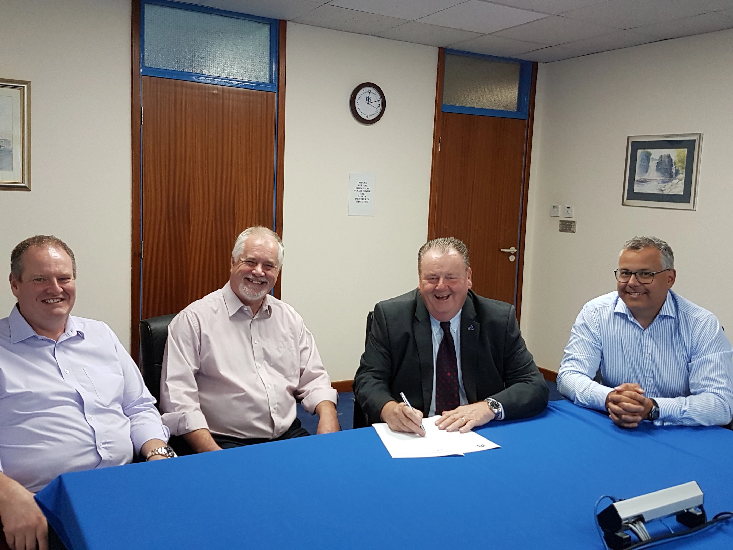 Dr Stan Higgins (third from left) is welcomed to ITS by, left to right: Mark Taylor (business development director, ITS), Malcolm Knott (managing director, ITS) and Graham Ives (projects director, ITS)