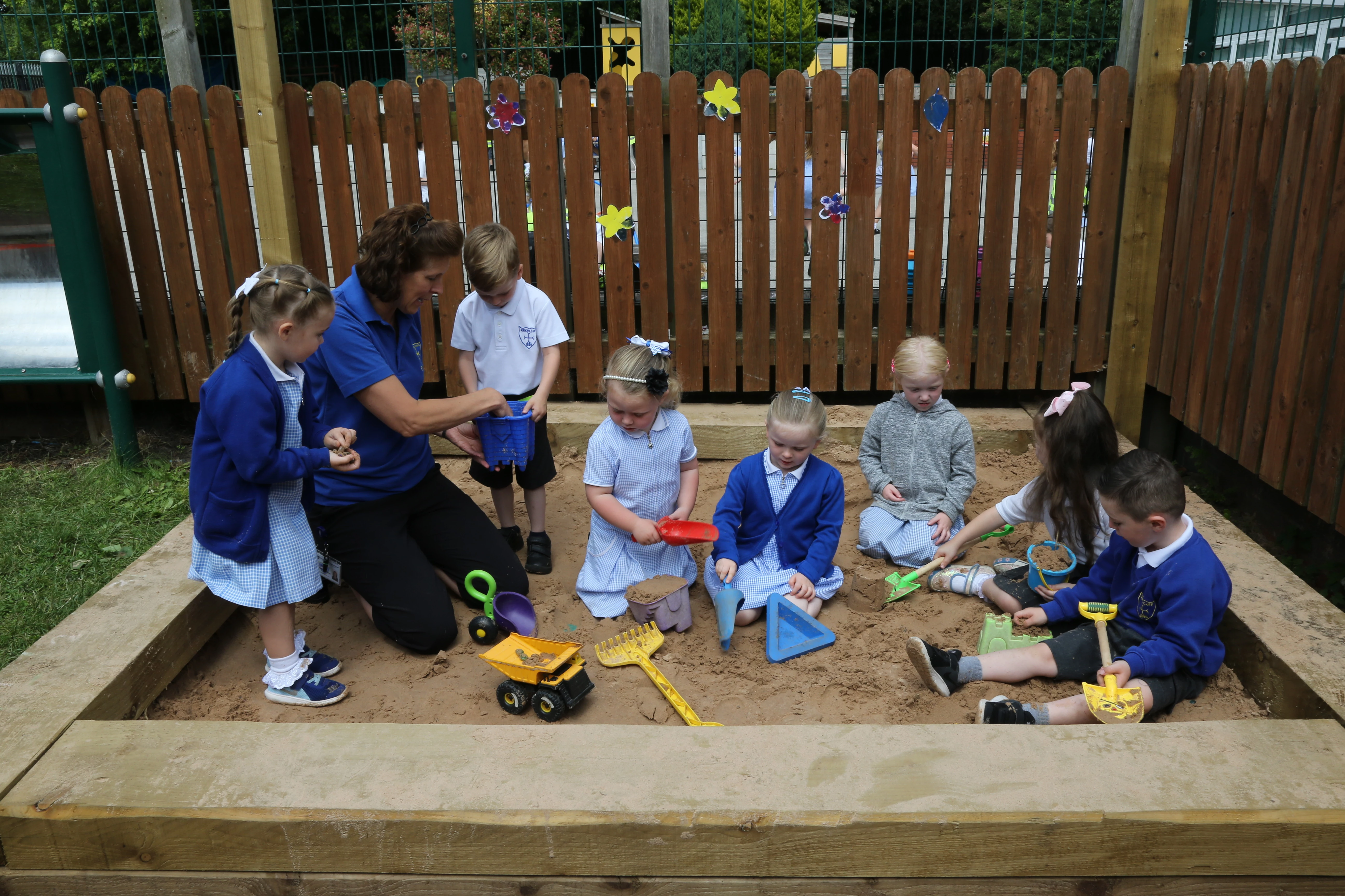 Nursery school children from Kirkby Church of England Primary School enjoying playing in the sandpit donated by St. Modwen
