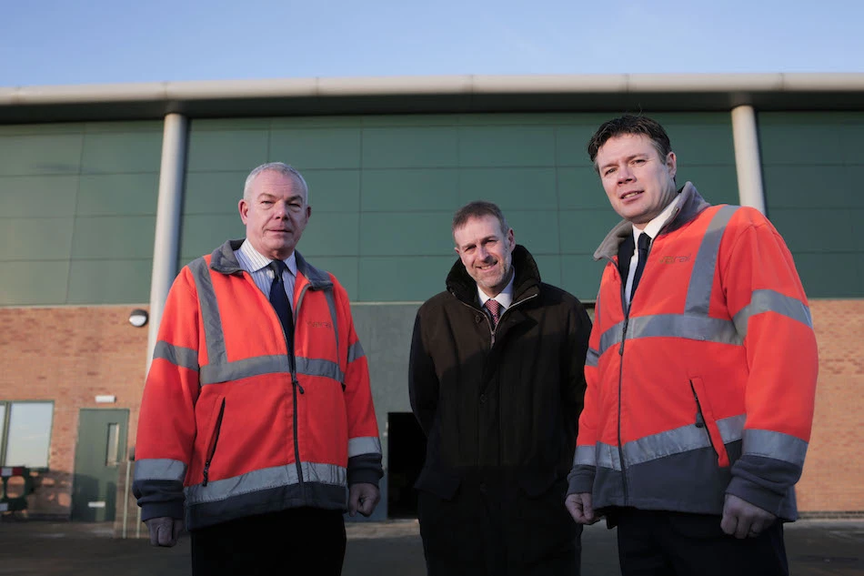Rob Mason (left) and Steve Rowell of Vivarail with Business Durham's Peter Rippingale at the firm’s new premises on Spectrum Business Park in Seaham, County Durham, UK.   