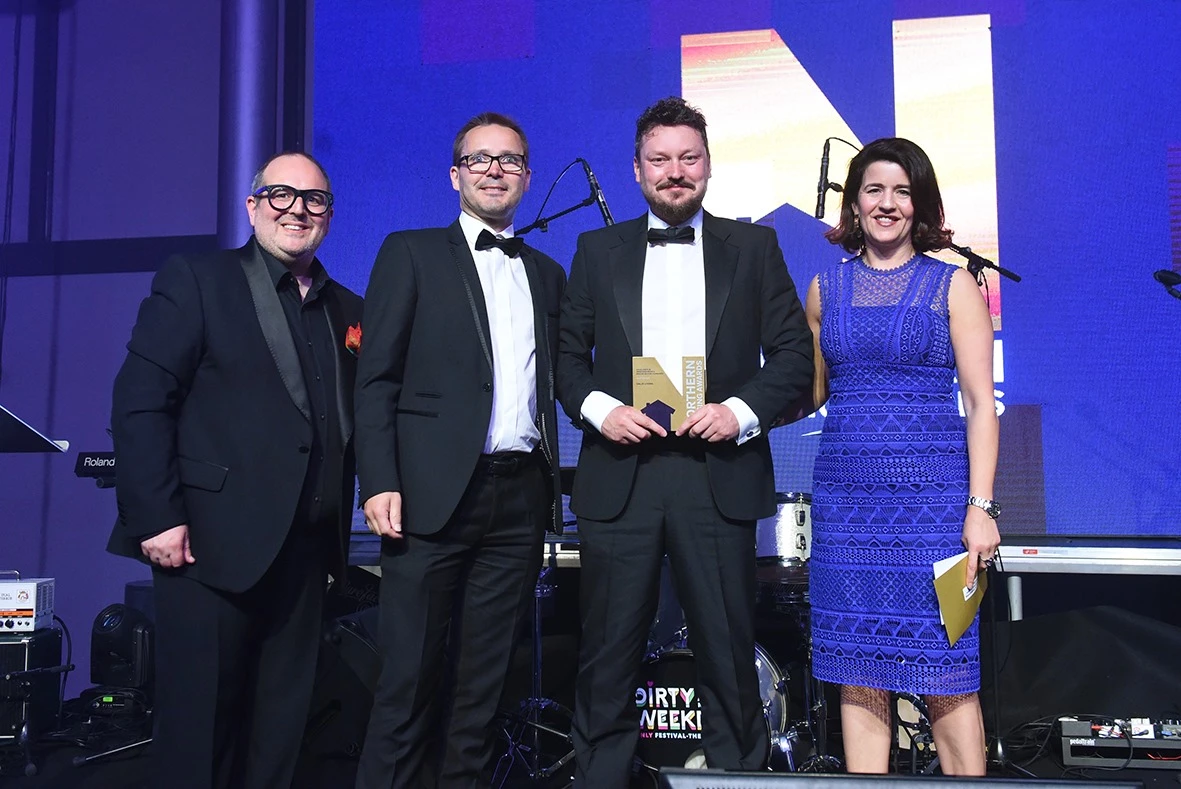 Jonathan Drake and Edward Sawford, from Salix Living, collect the award from Northern Housing Awards host Justin Moorhouse and Tracy Harrison, chief executive of the Northern Housing Consortium. 