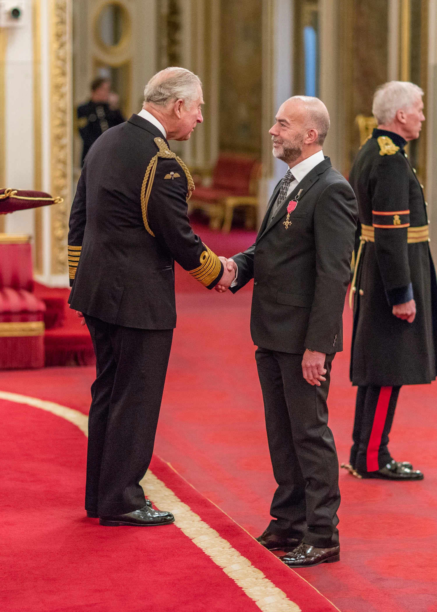Vincent Ferguson of Inciner8 collecting his OBE