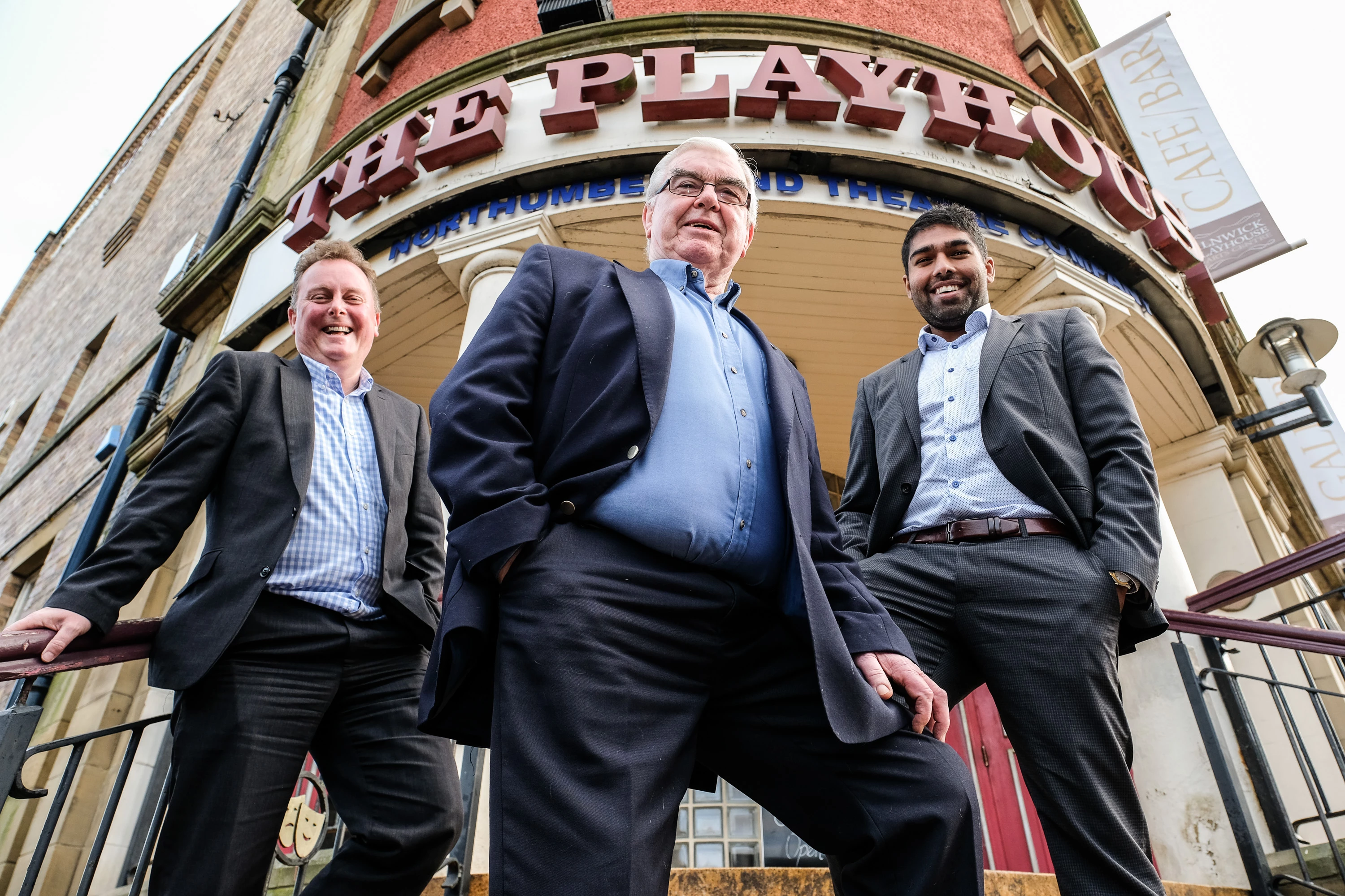Bryan Ellis of Northumberland Theatre Company (centre) with Peter Millican (left) and Ricky Handa of Peter Millican Law on the steps of the Alnwick Playhouse