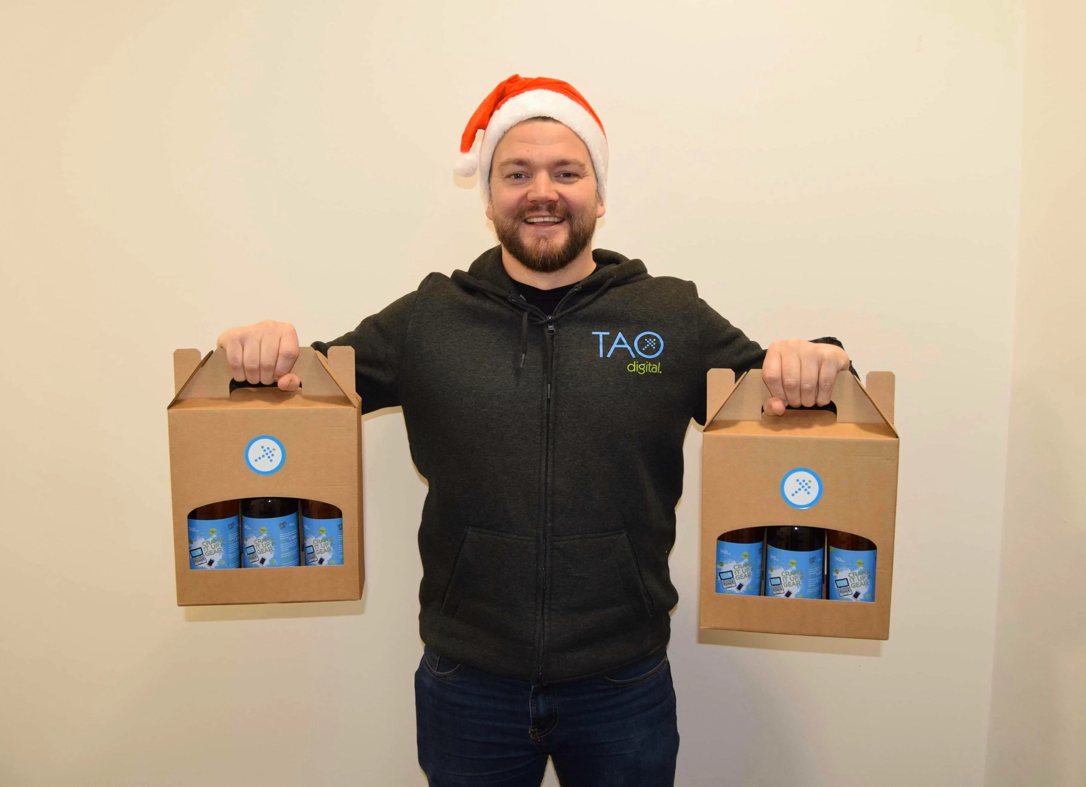 Matt Tomkin holding Tao Digital IPA