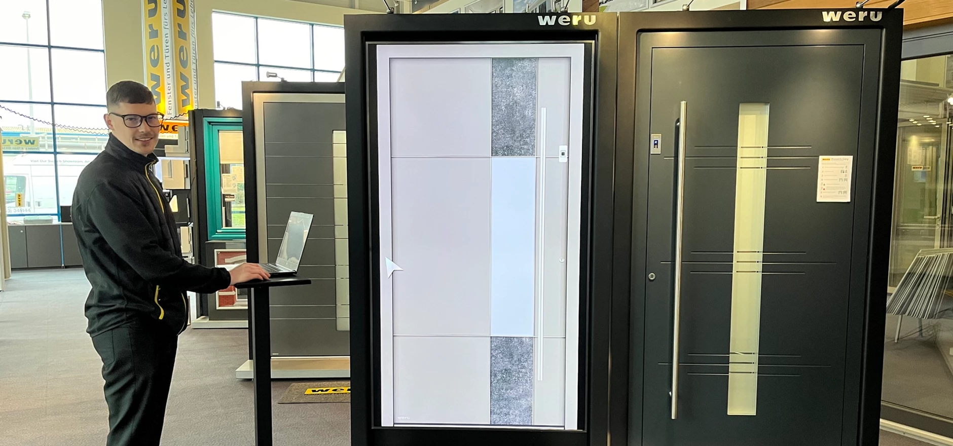 Sandis Komorovskis, Technical Sales Estimator at Weru UK, pictured with  Weru's in-store door configurator - small.jpg