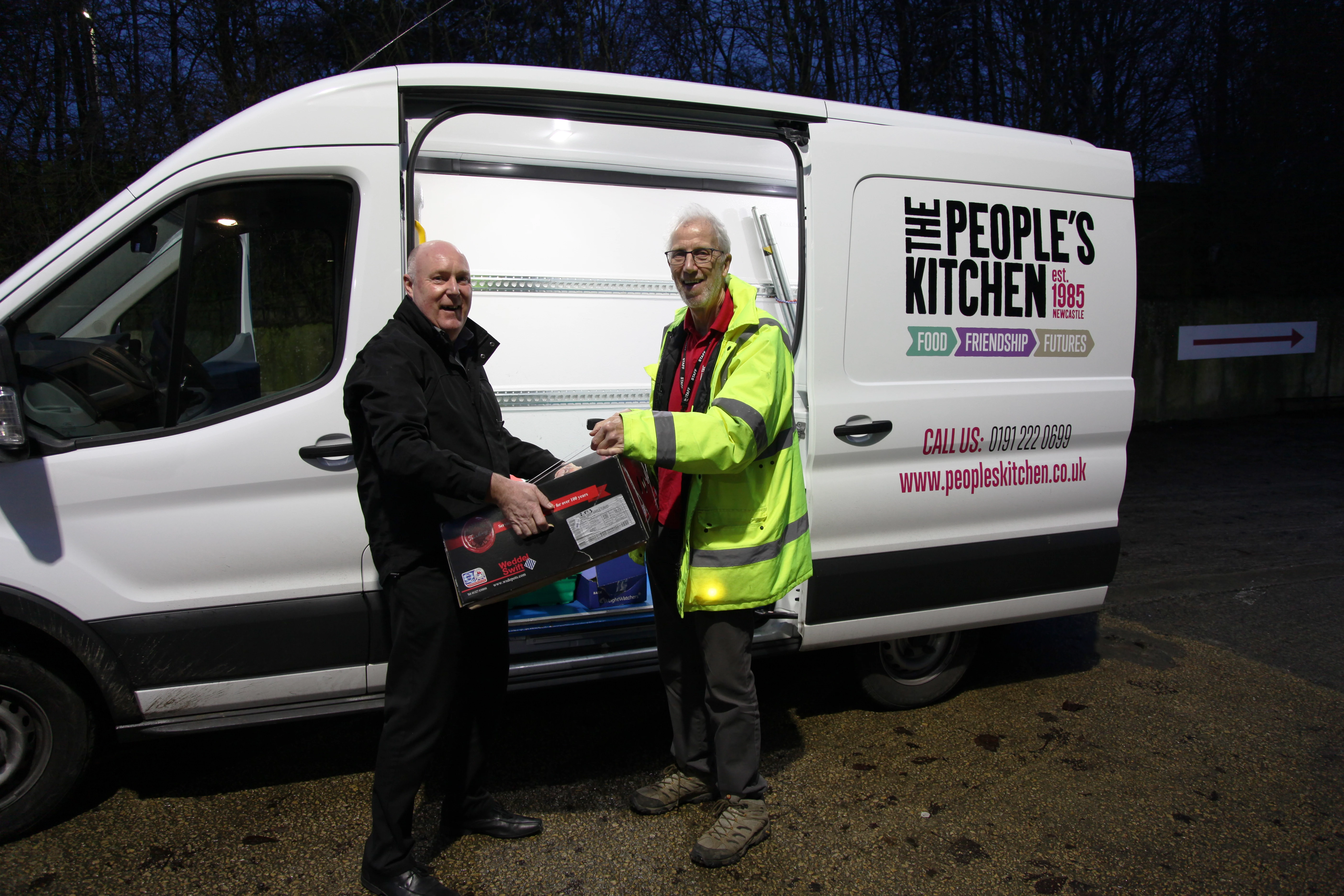 Trevor Cossins, Managing Director at P C Henderson with a team member from The People's Kitchen