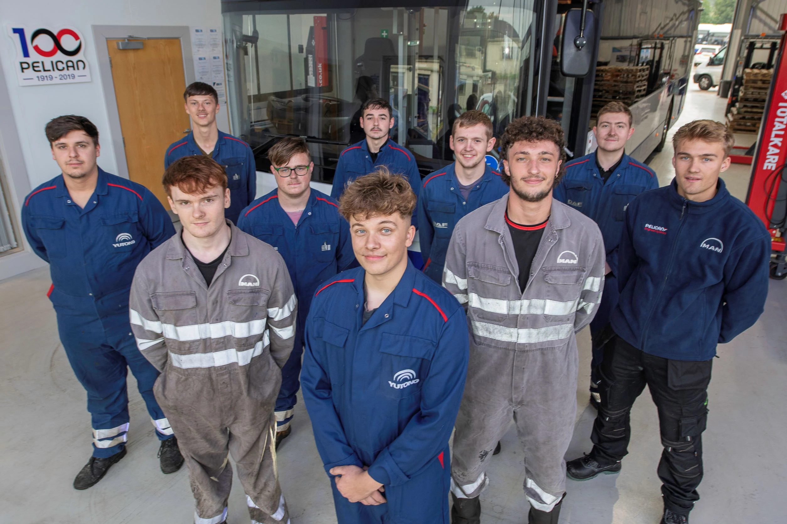 Apprentice body shop technician Josh Waring (centre front) with some of the other Pelican Engineering apprentices 