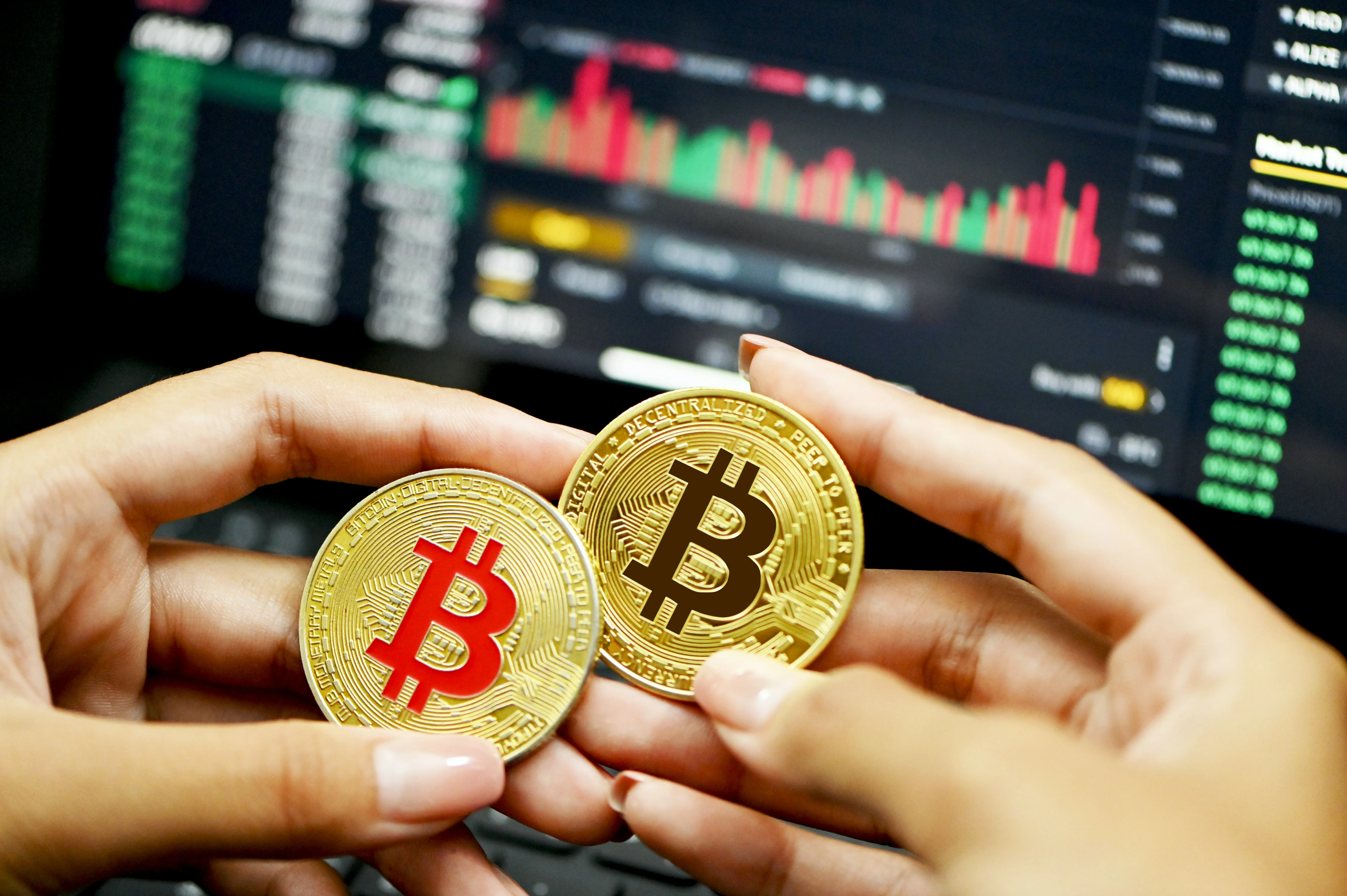 Two Bitcoins held in both hands