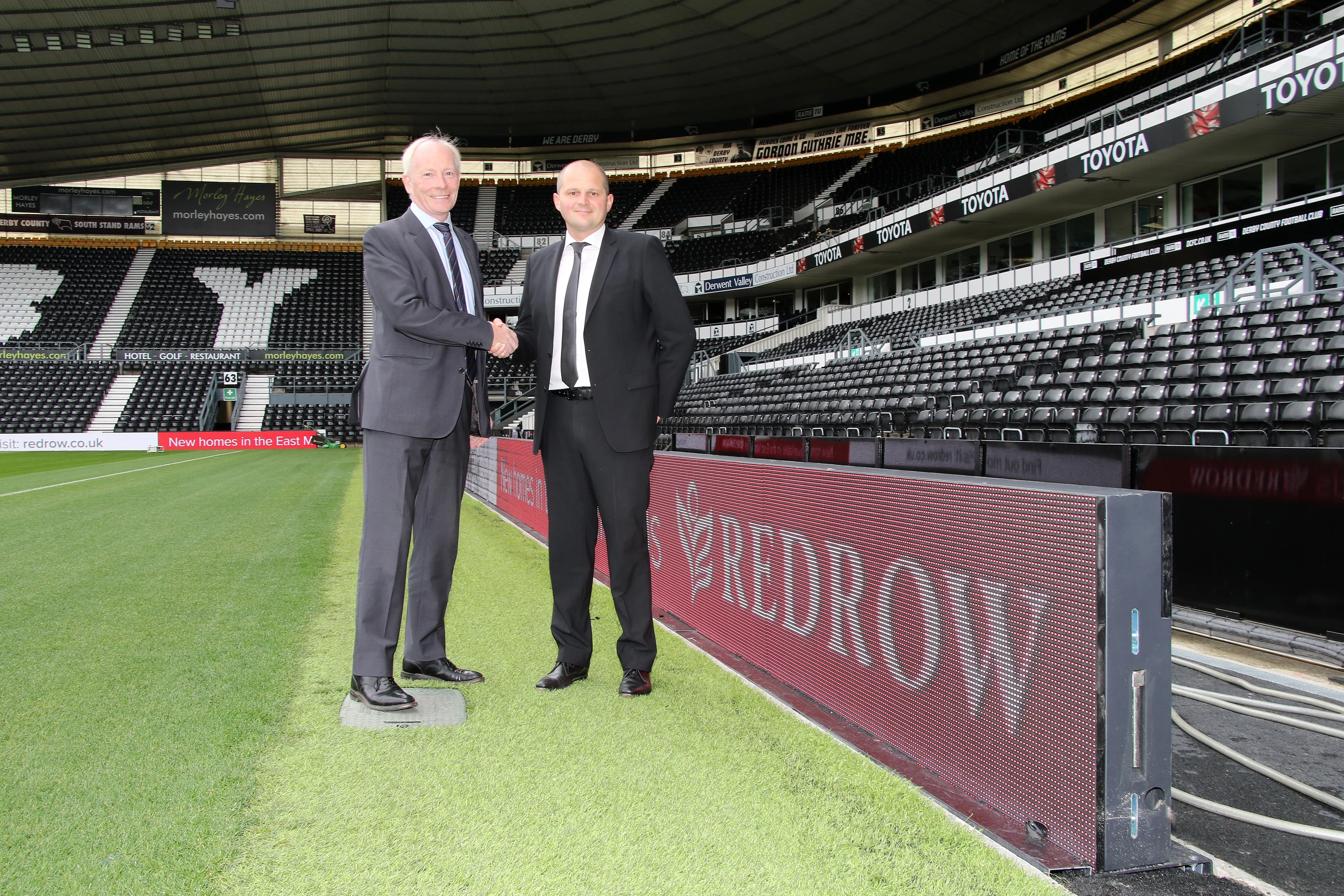 Tom Finnegan, managing director of Redrow Homes and Ashley Peden, Director of Partnerships at Derby County Football Club.