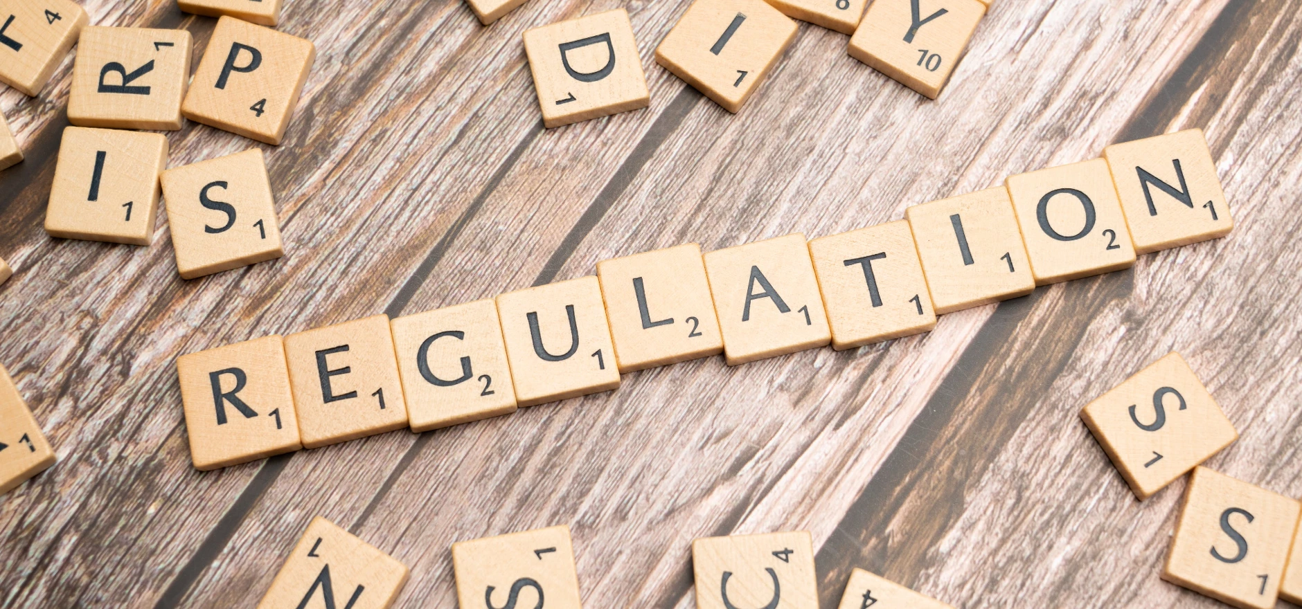 Scrabble letters spelling the word regulation