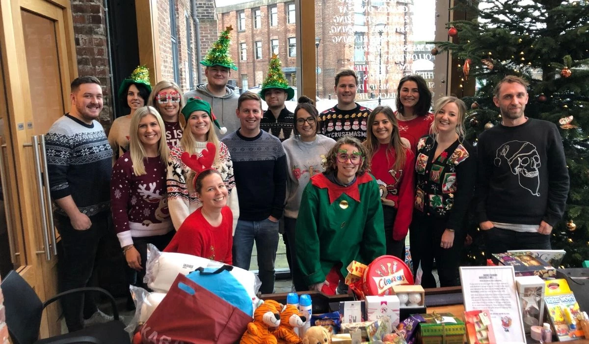 Tenants at Marshall's Mill with gifts donated to Leeds Women's Aid