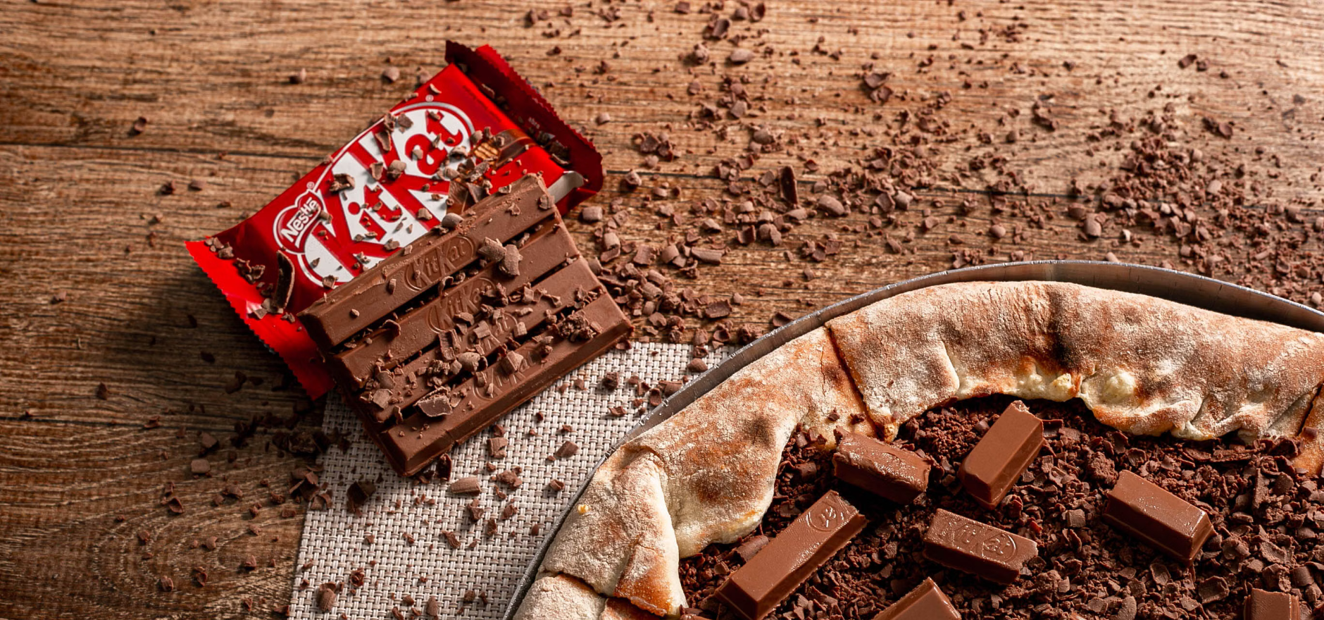 Indulge in a unique fusion of pizza and KitKat chocolate bars, perfect for dessert lovers.