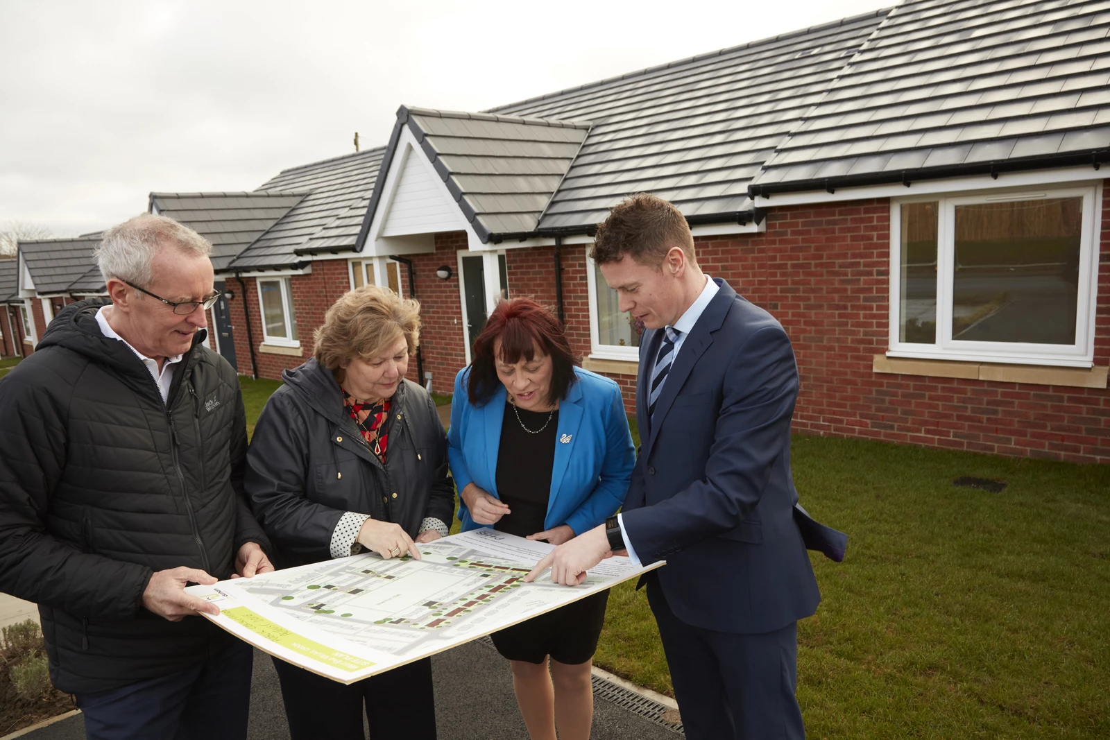 County Durham Housing Group Chief Executive Bill Fullen and Board Chair Judith Common with Cllr Anne Reed and Phil Hunter from Galliford Try Partnerships North at the completed development at West End Villas in Crook.