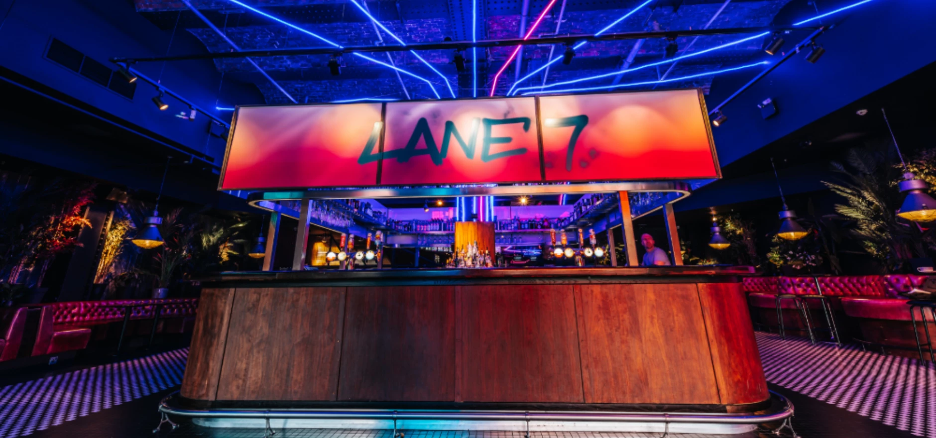 Lane 7_ A Vibrant Bar with Neon Lights and Modern Decor.jpg