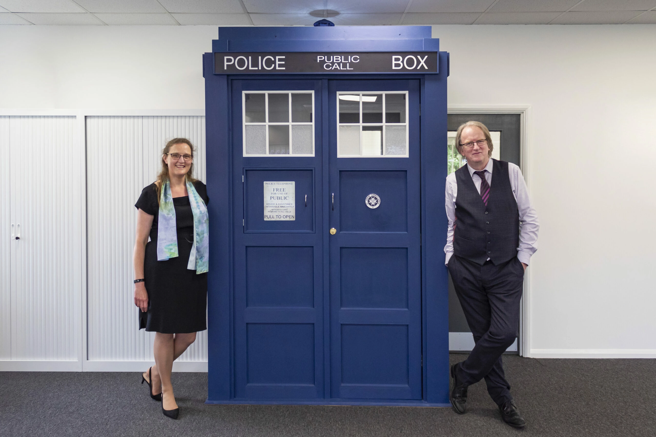 Directors of HMB Accountants, Sarah and Howard Bedford with the new office Tardis