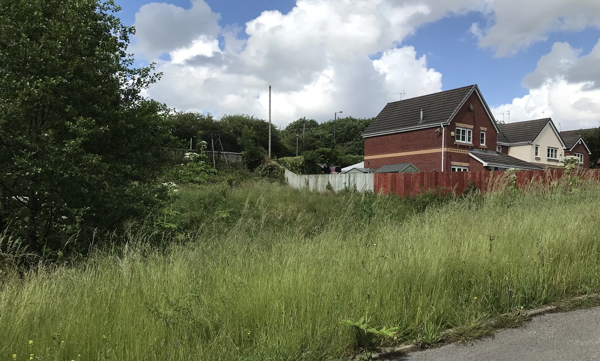 Northern Property Consortium’s newly acquired site on Godley Brook Lane where it will build two new four-bedroom detached homes.