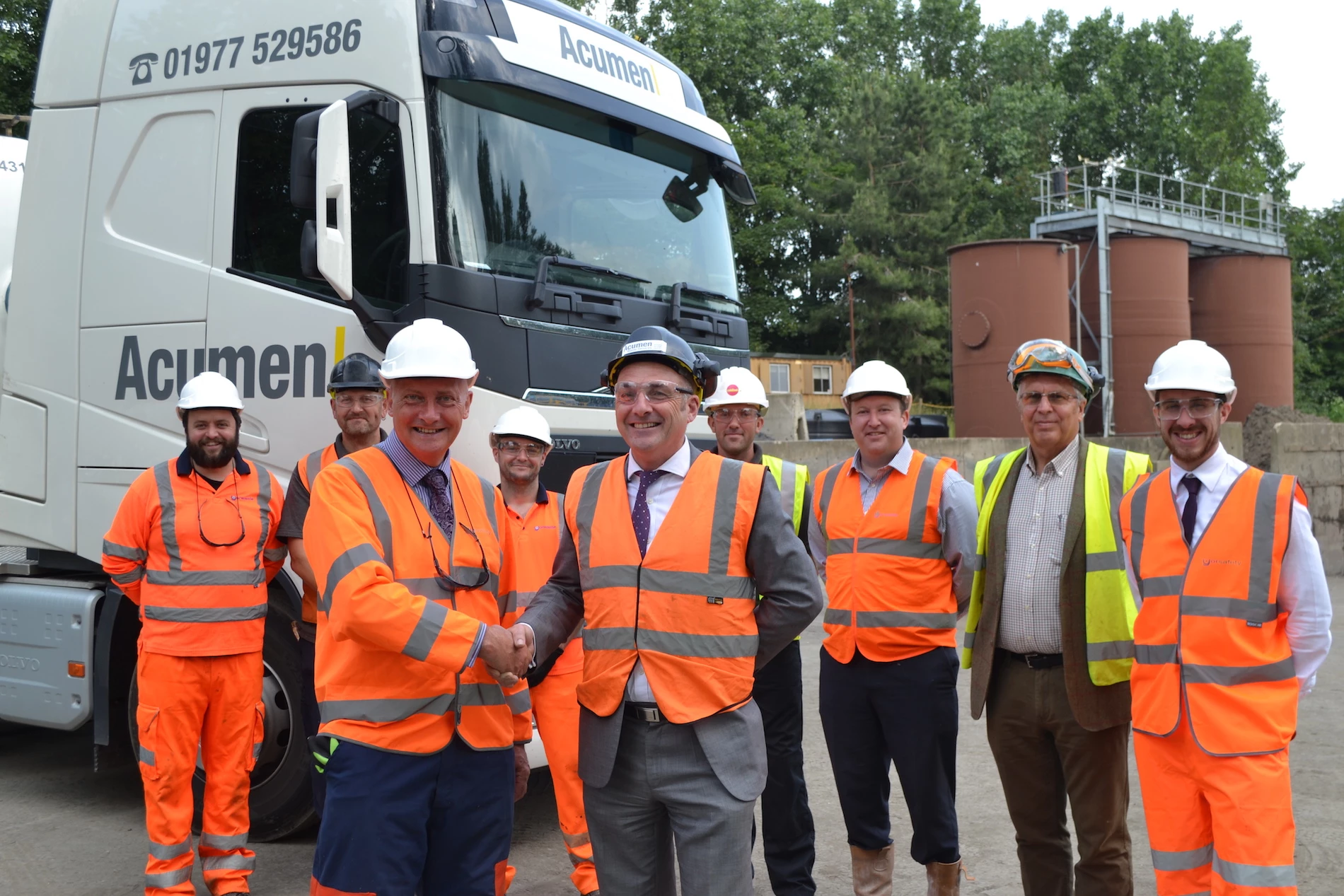 Geoff Derham (left) from Yorwaste shakes hands with Leon Kirk at the Harewood Whin liquid treatment plant.