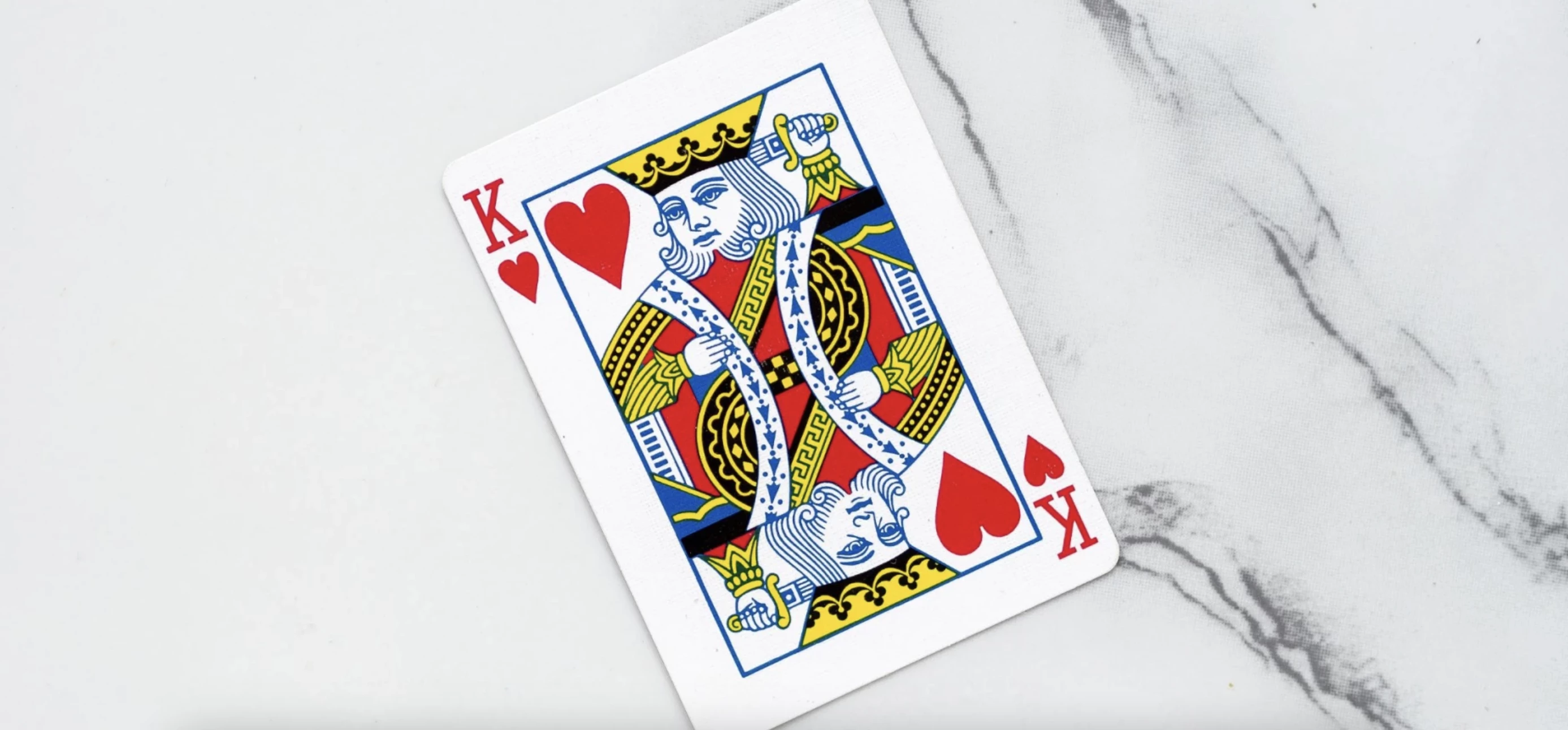 King of hearts card on a marble background