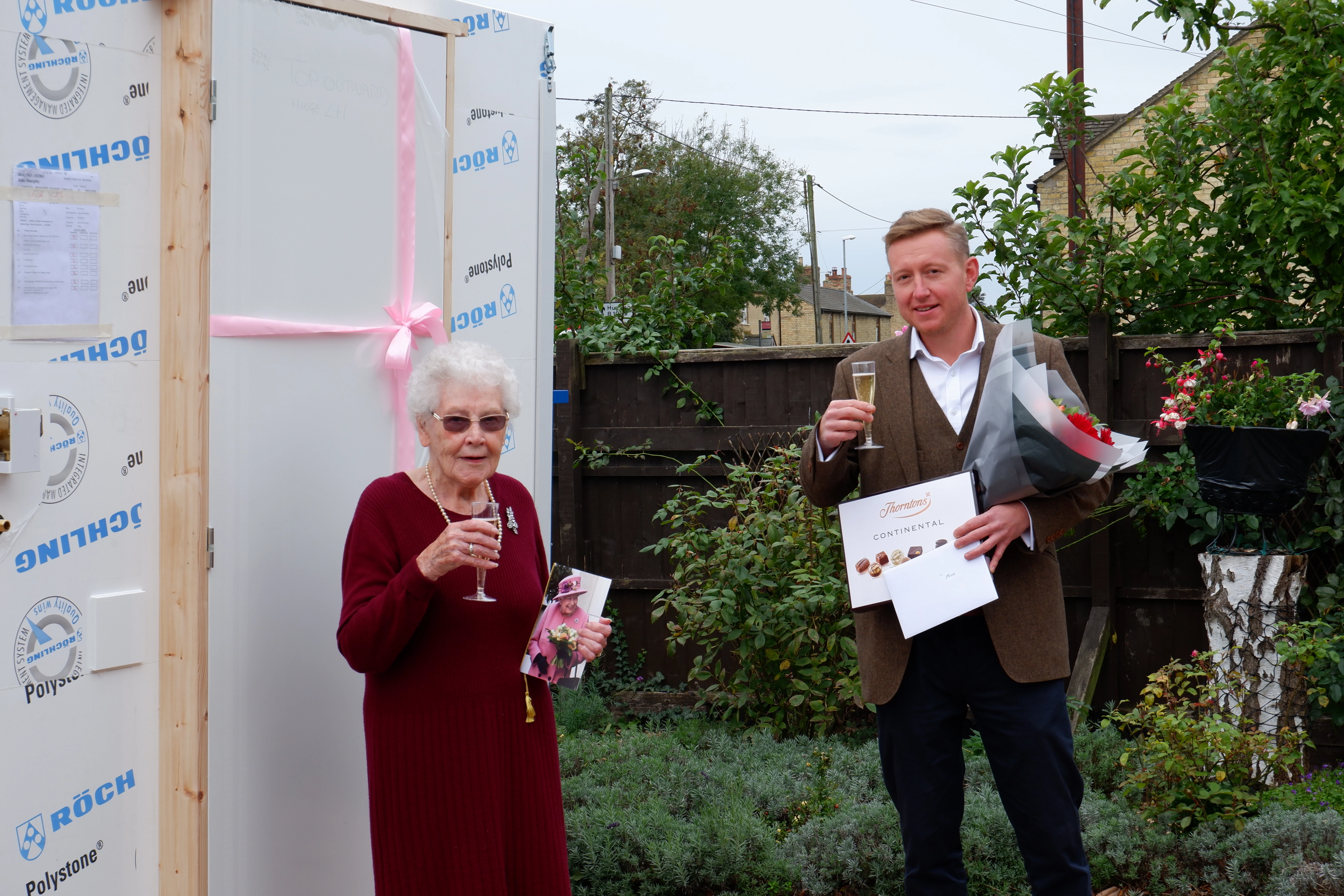 (left to right) Cambridgeshire centenarian Mona Garbutt celebrating her birthday with Taplanes Specification Engineer Dan Wilkinson